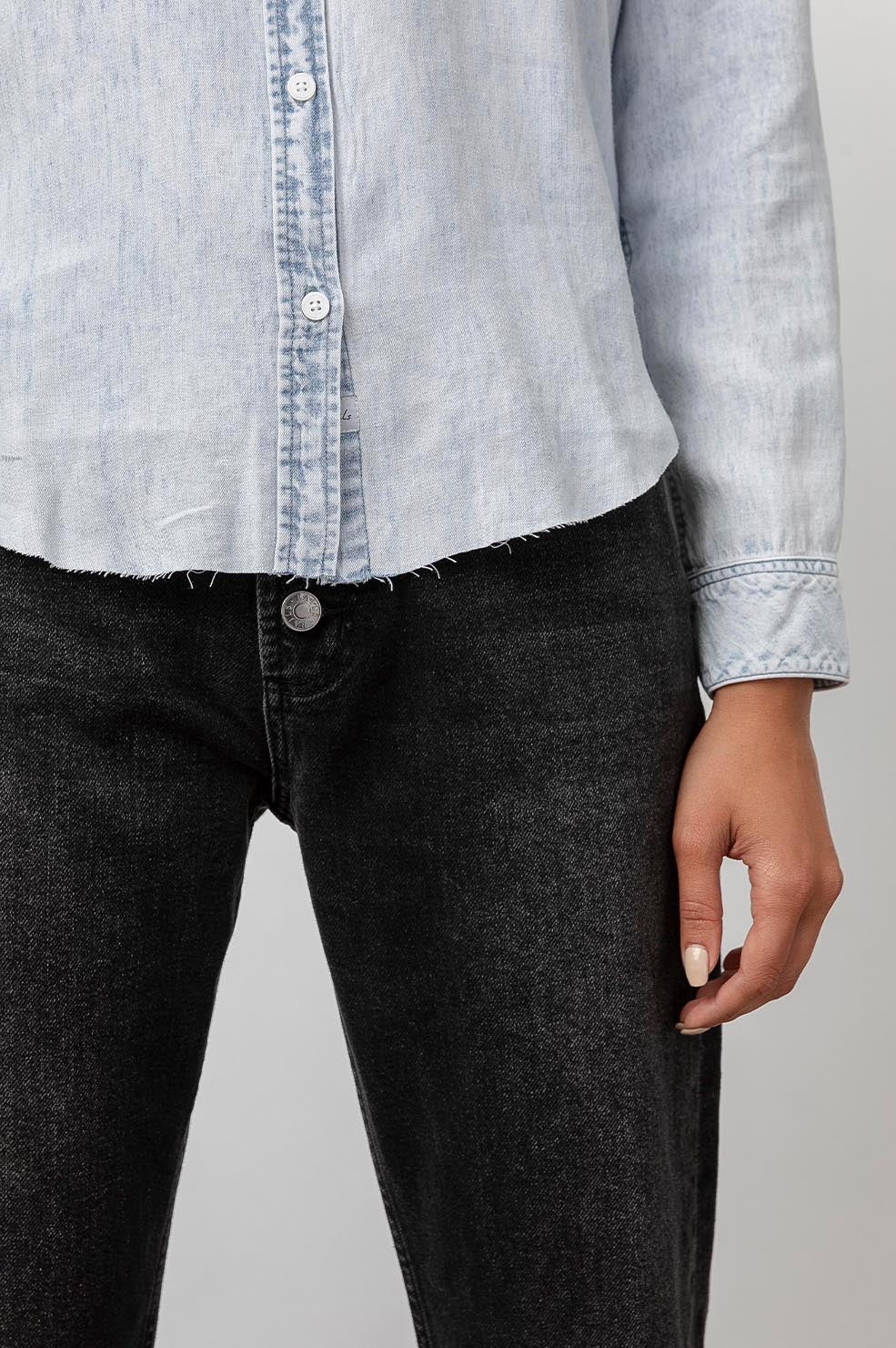 Ingrid Raw Hem, Long Sleeve Denim Button Up with a Chest Patch Pocket in Light Acid Wash Colorway - Front View Featured on Model