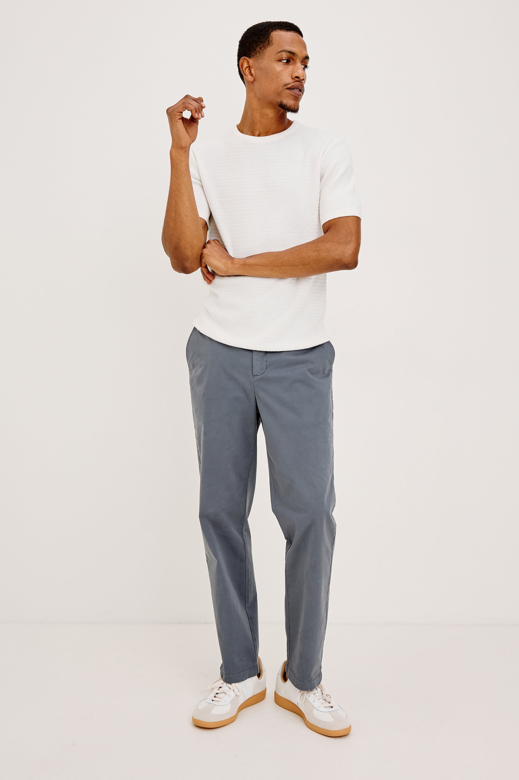 Irving Slim Straight Pant With Side Slant Pockets, and Back Welt Pockets in Meridian, a blue Colorway - Full body Front View Featured on Model