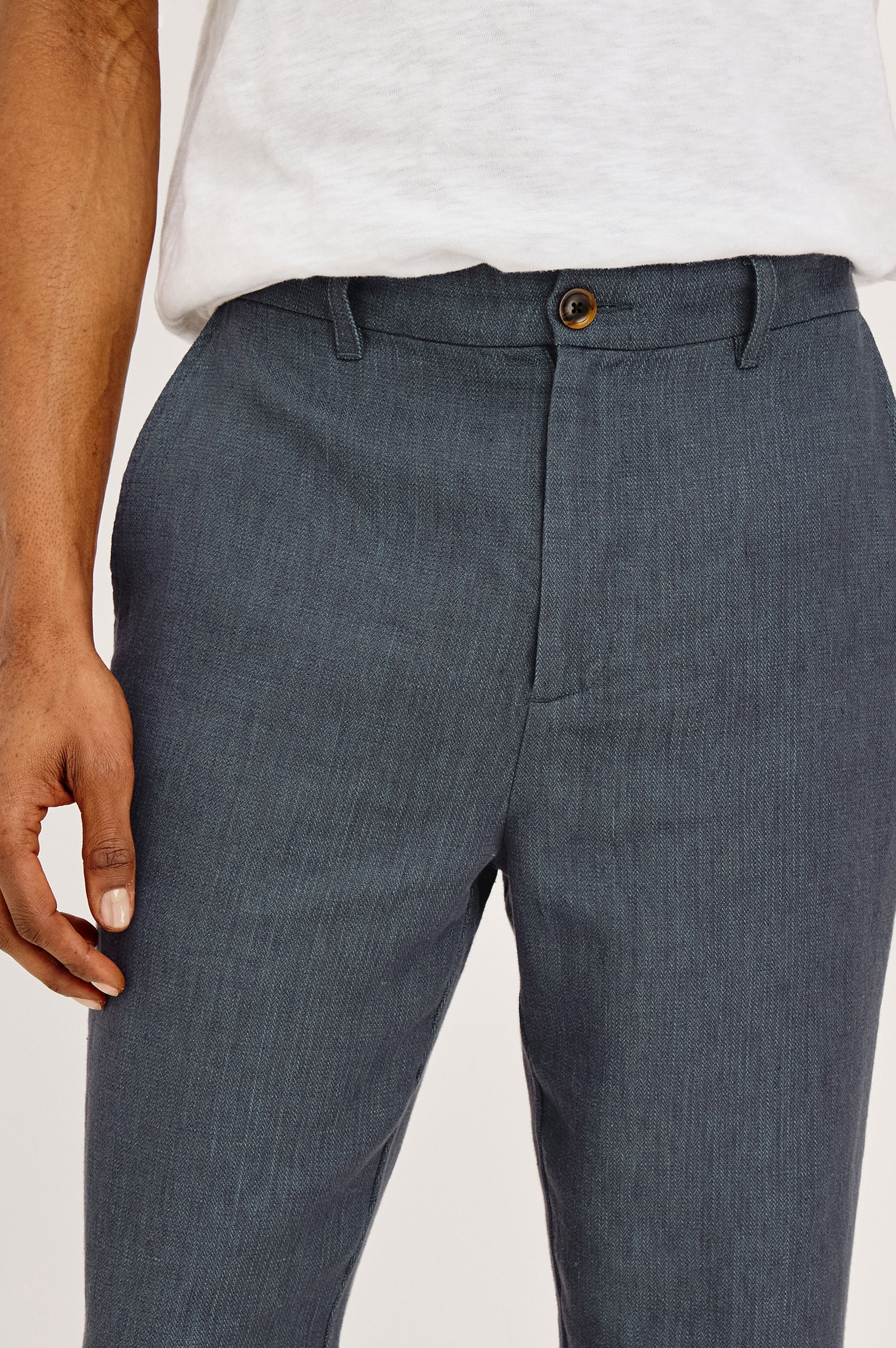 Irving Slim Straight Pant With Side Slant Pockets, and Back Welt Pockets in Meridian, a blue Colorway - Close up View Featured on Model
