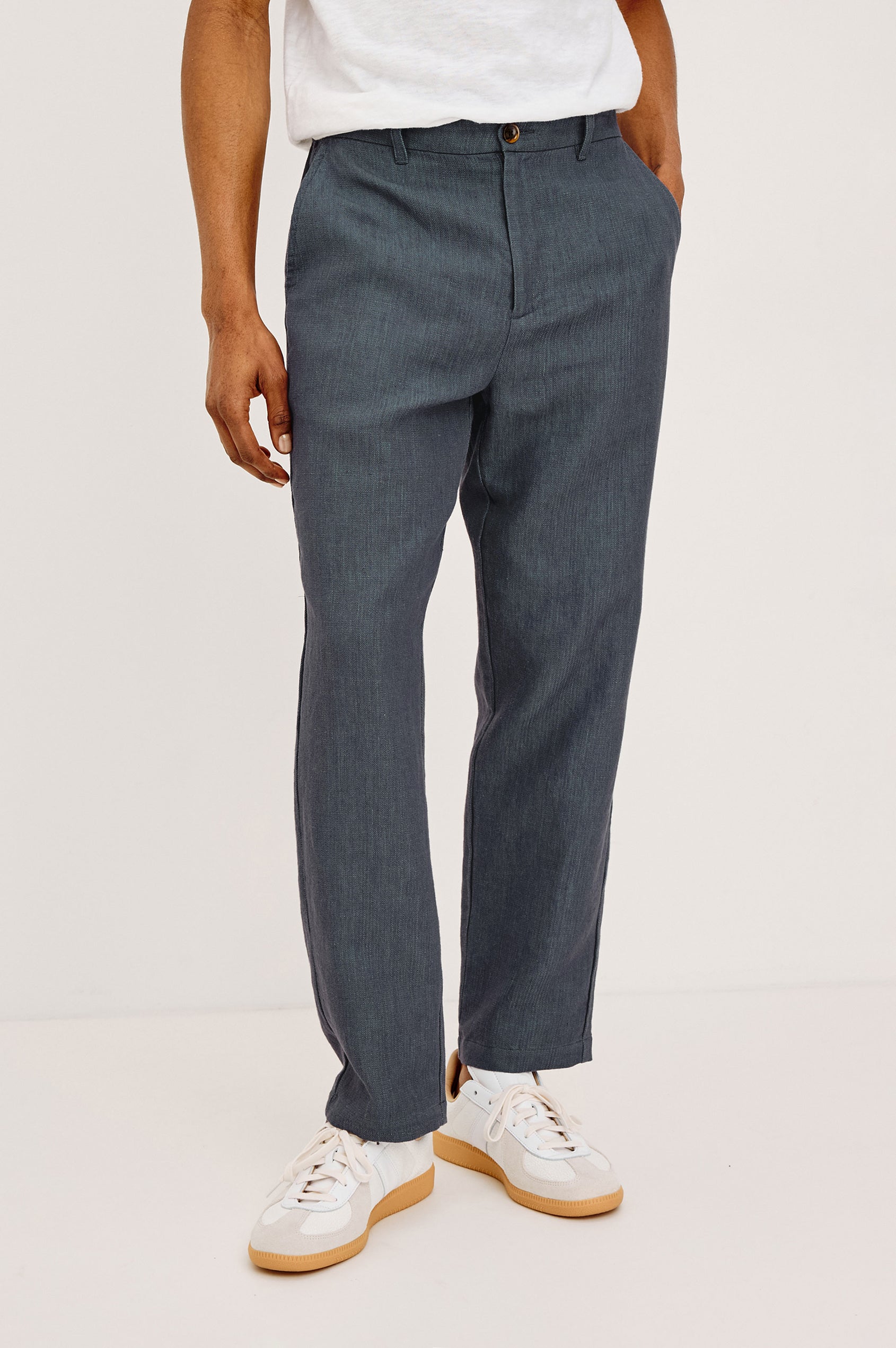 Irving Slim Straight Pant With Side Slant Pockets, and Back Welt Pockets in Meridian, a blue Colorway - Front View Featured on Model