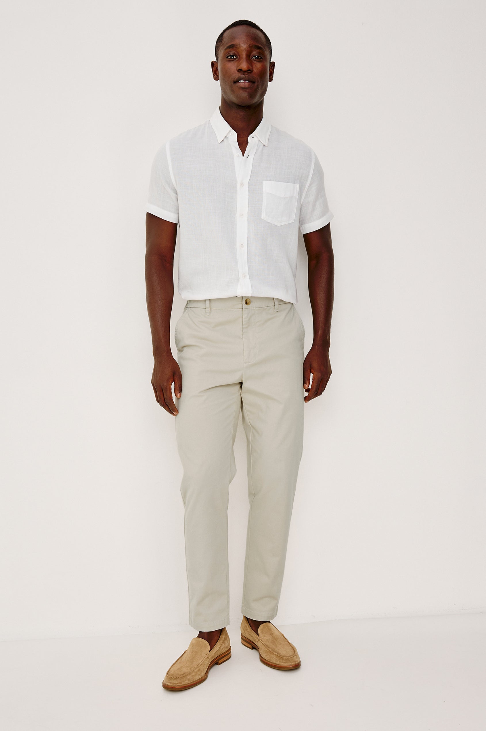 Irving Slim Straight Pant With Side Slant Pockets, and Back Welt Pockets in Stone Colorway - Full Body Front View Featured on Model