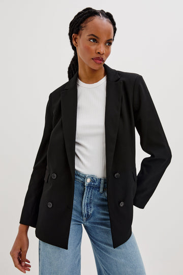 Jac Double-Breasted Blazer with Two Front Flap Pockets and a Notched Label in Black Twill Colorway - Front View Featured on Model