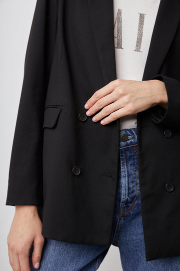 Jac Double-Breasted Blazer with Two Front Flap Pockets and a Notched Label in Black Twill Colorway - Front View Featured on Model