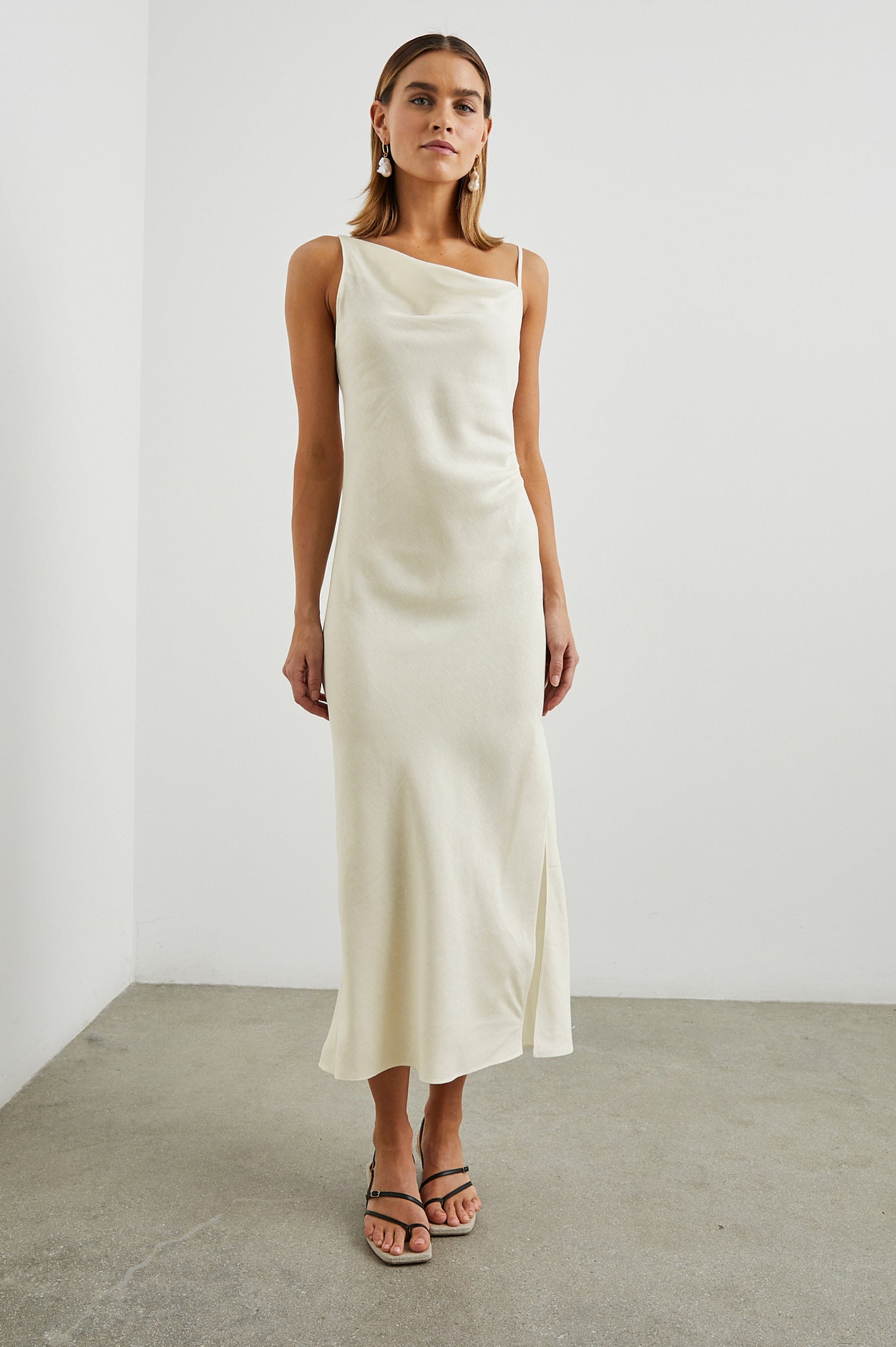 Lotus Sleeveless Midi Dress with an Asymmetrical Cowl Neck, Adjustable Back Spaghetti Straps, a Side Slit, Light Ruching on one Bodice Side in Lotus Colorway - Front Full Body View Featured on Model