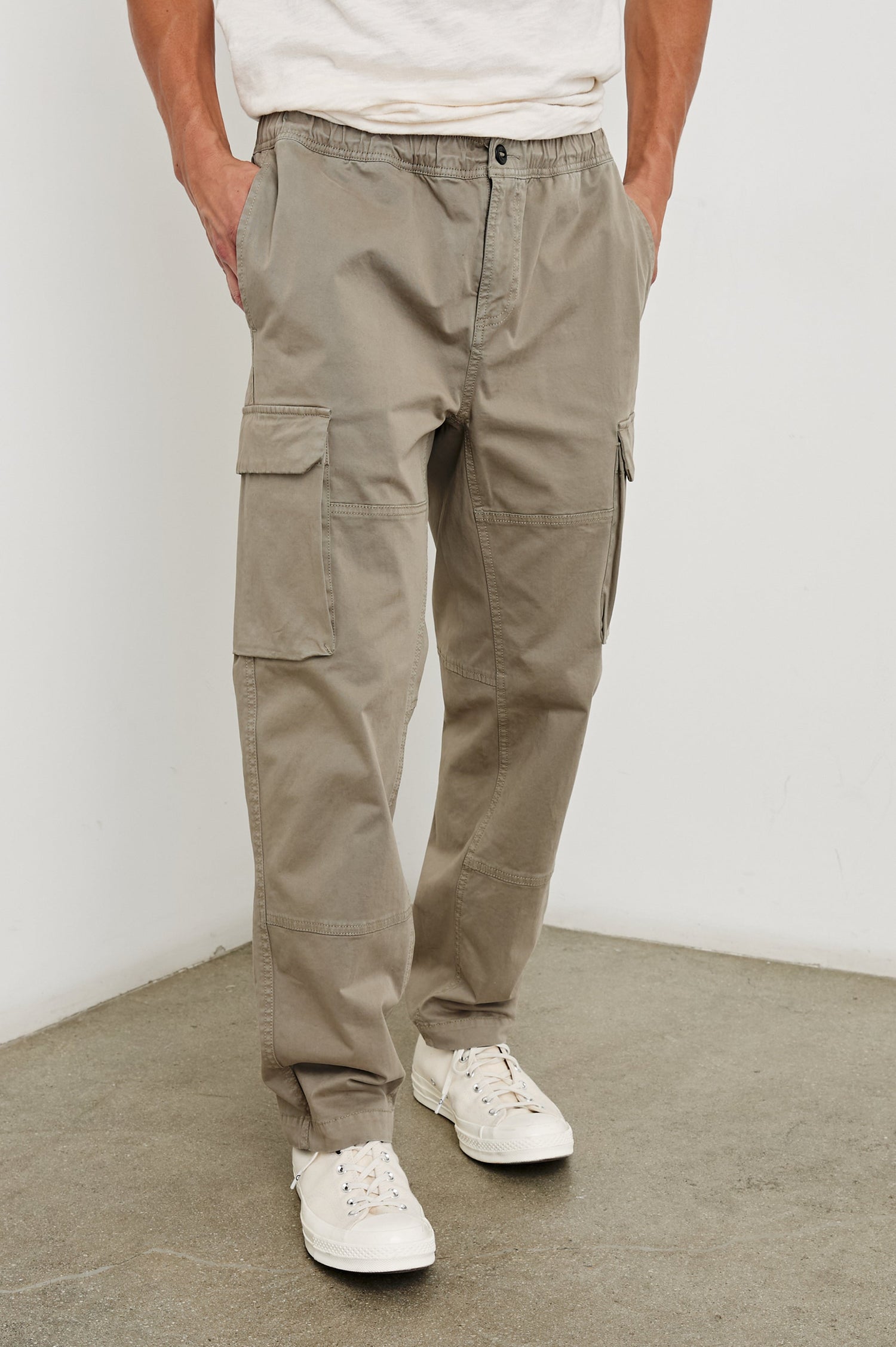 Jaiden Pants with an Elastic, Button Waist with Zip Fly, Two Front Pockets, Two Side Flap Pockets, and Two Back Flap Pockets in Barley Colorway - Front View Featured on Model