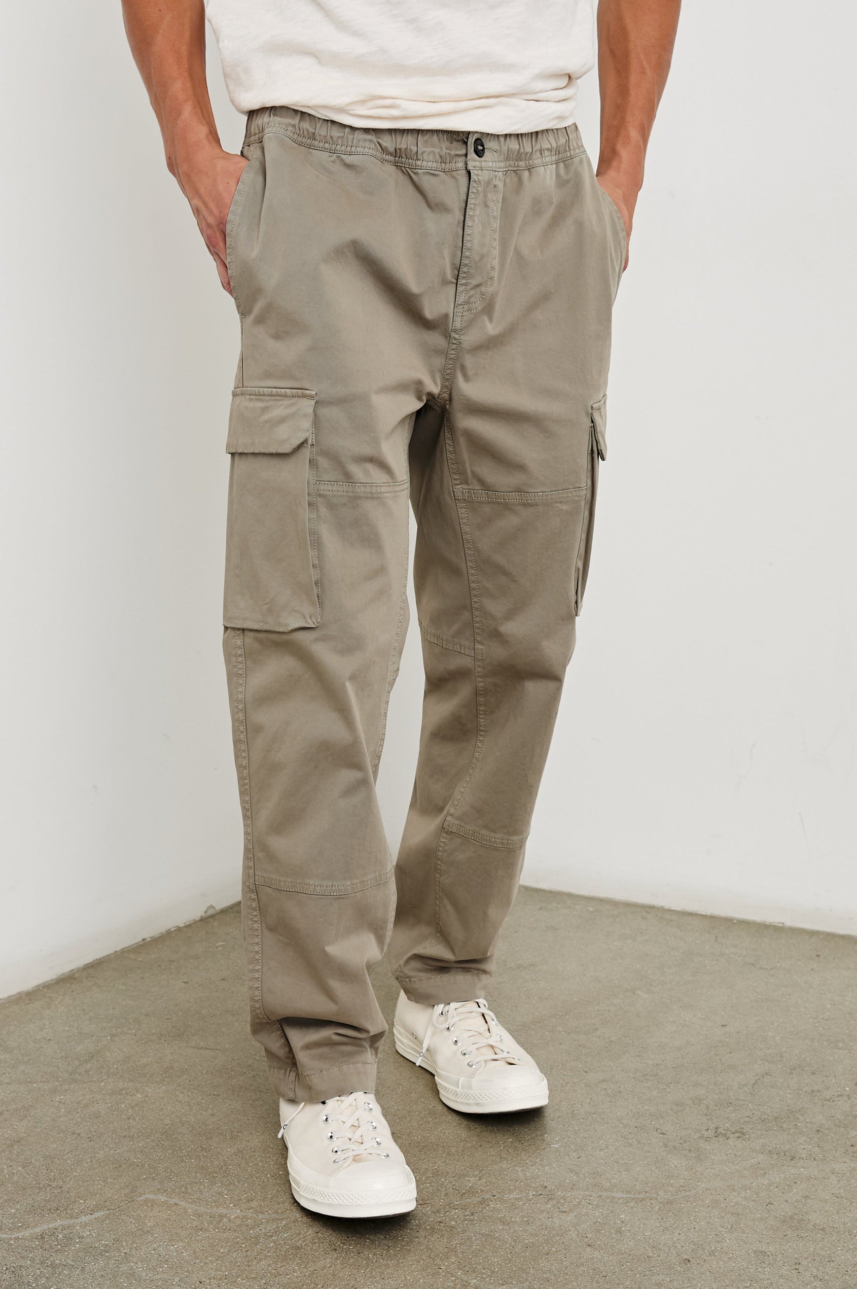 Jaiden Pants with an Elastic, Button Waist with Zip Fly, Two Front Pockets, Two Side Flap Pockets, and Two Back Flap Pockets in Barley Colorway - Front View Featured on Model