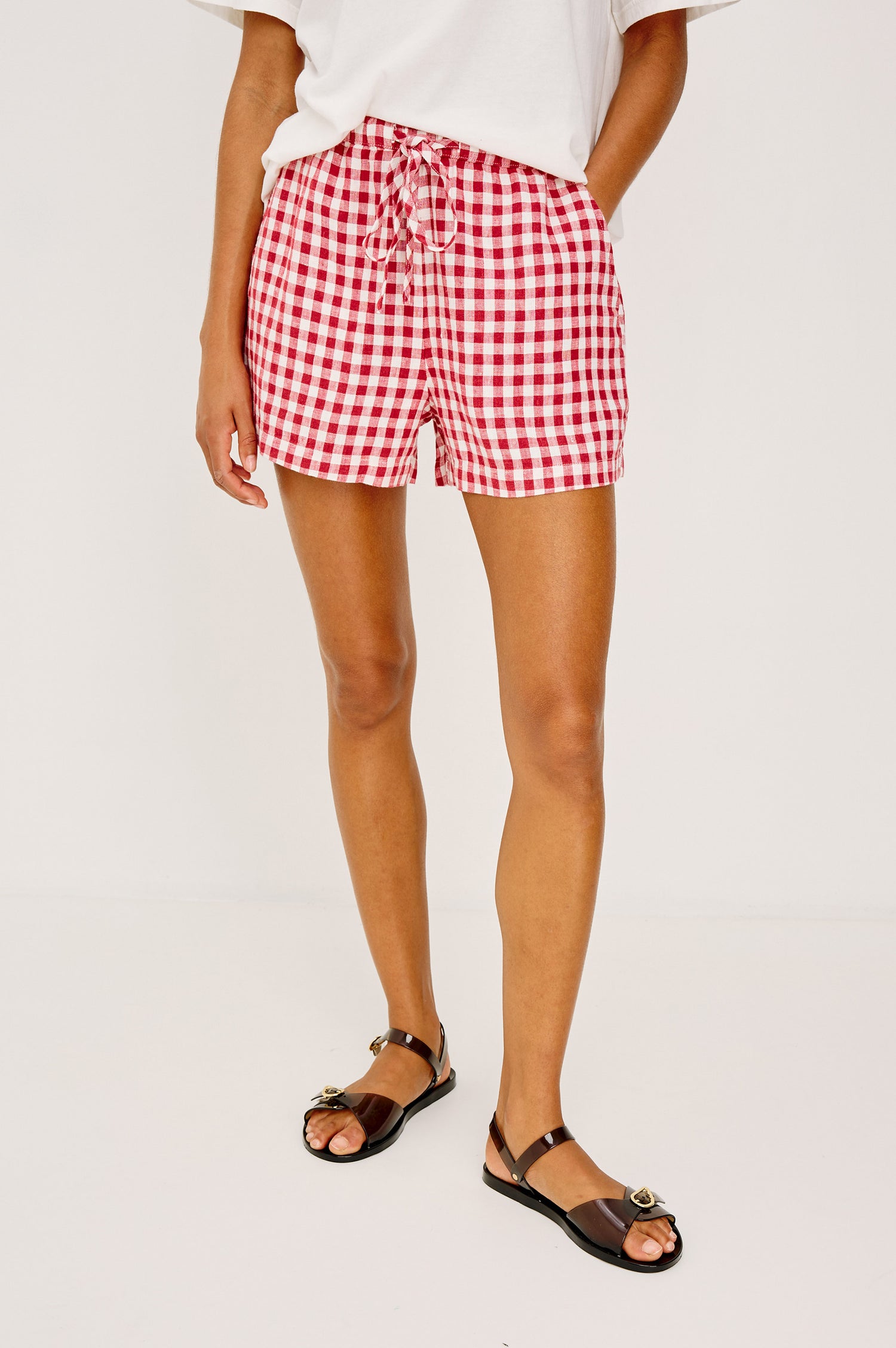 Jenner High-Waisted Short in Unlined Linen With Adjustable Drawstring Waist TIes, Side Pockets, and Relaxed Fit in Picnic Check Colorway - Lower Body Front View Featured on Model