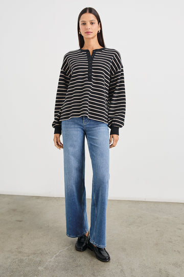 Joan Long-Sleeve Sweatshirt with Buttons to the Mid-Torso and Cuffed sleeves in Black Ivory Stripe Colorway, horizontal stripes - Front Full Body View Featured on Model