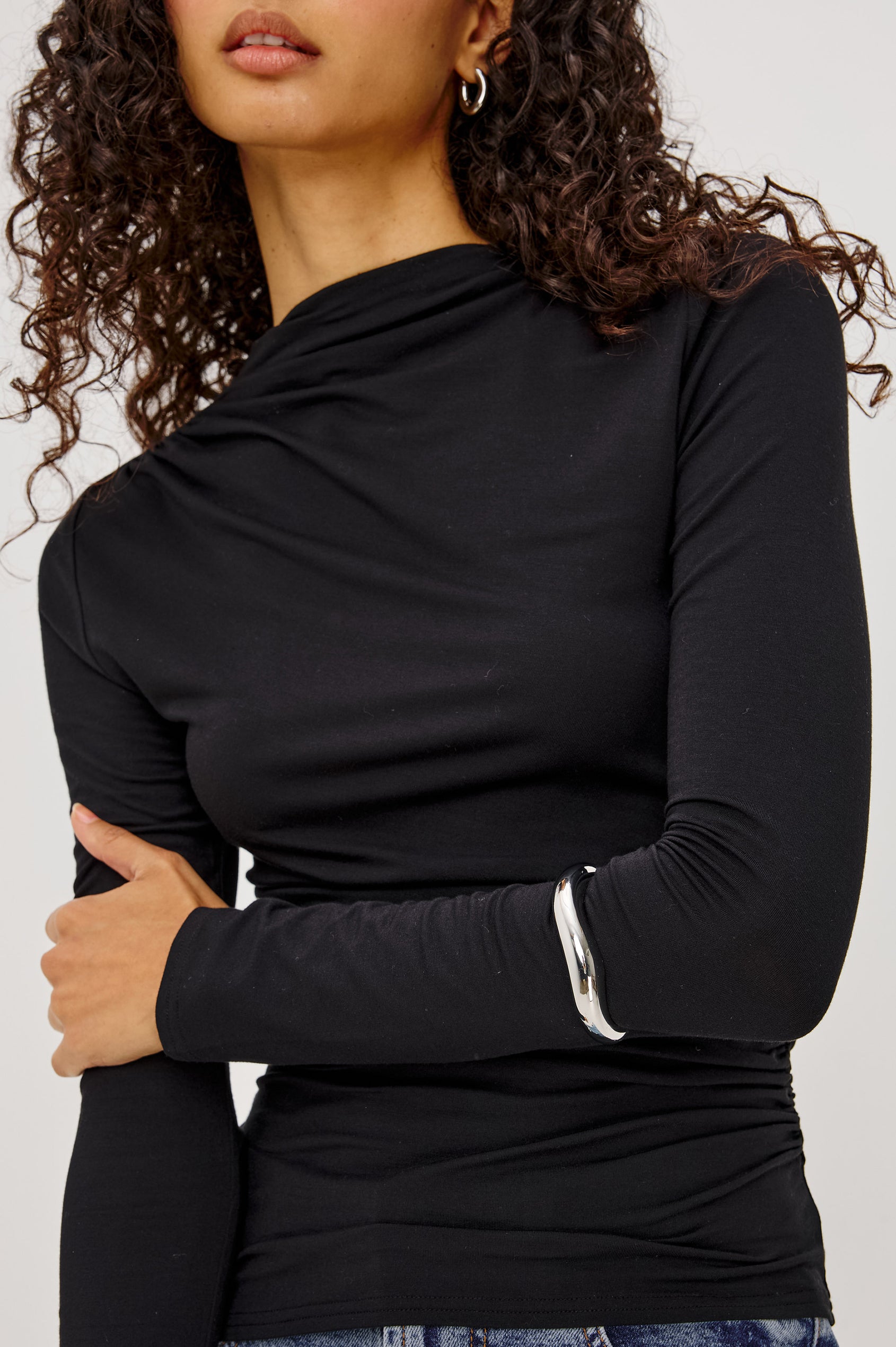 Joelle Top in Soft Jersey With High Funnel Neckline, Long Sleeves, Self-Lined Body, and Asymmetric Ruching at Shoulder and Waist in Black Colorway - Upper Body Front View Featured on Model