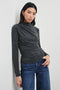 Joelle Long Sleeve Top with An Asymmetrical Mock Neck and Shirring on the Right Shoulder in Charcoal Colorway - Front View Featured on Model