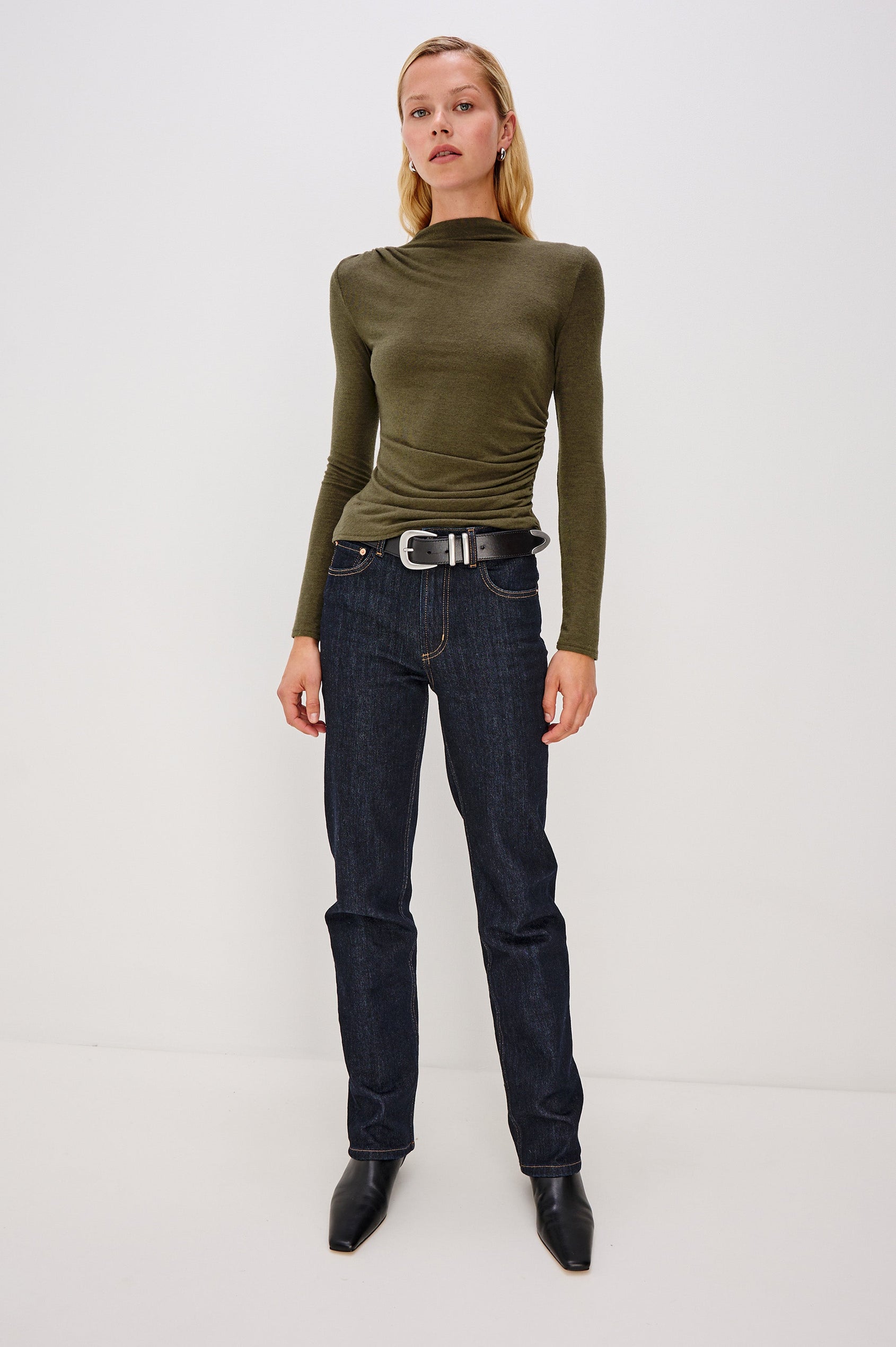Joelle Long Sleeve Top with An Asymmetrical Mock Neck and Shirring on the Right Shoulder in Heather Olive Colorway - Full Body Front View Featured on Model