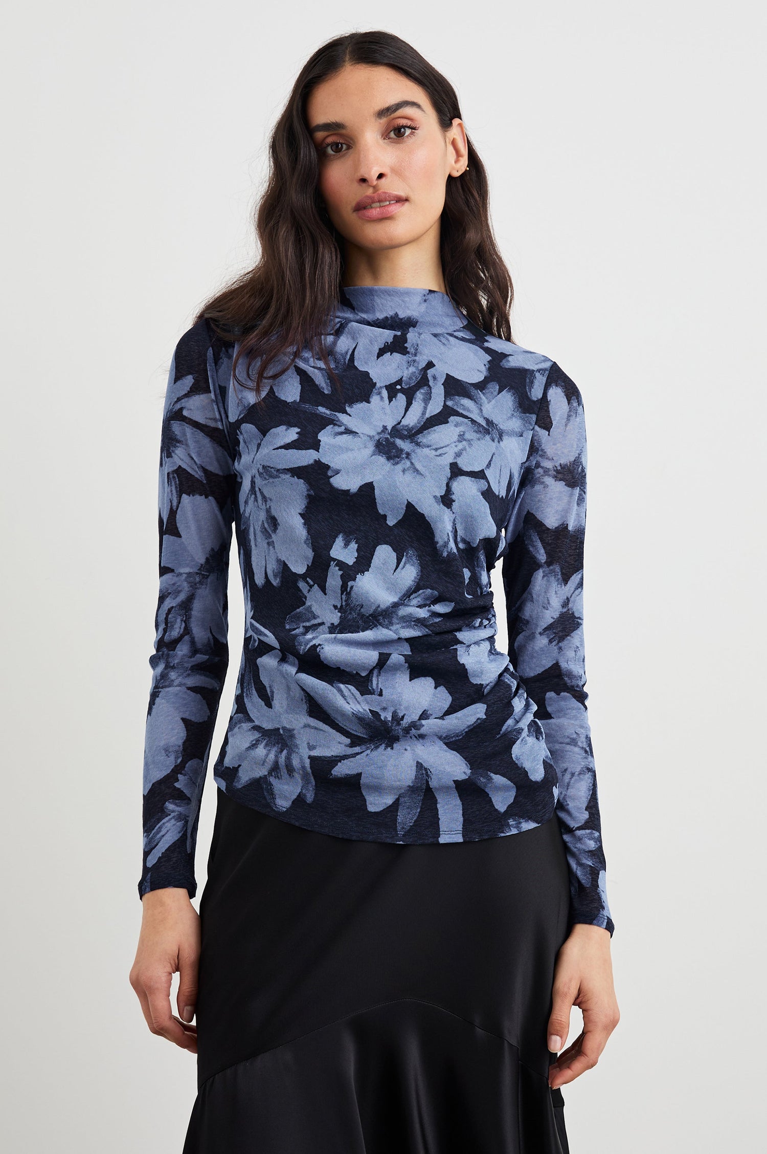 Joelle Long Sleeve Top with An Asymmetrical Mock Neck and Shirring on the Right Shoulder in Midnight Lily Colorway, with blue Lilies on Midnight - Front View Featured on Model