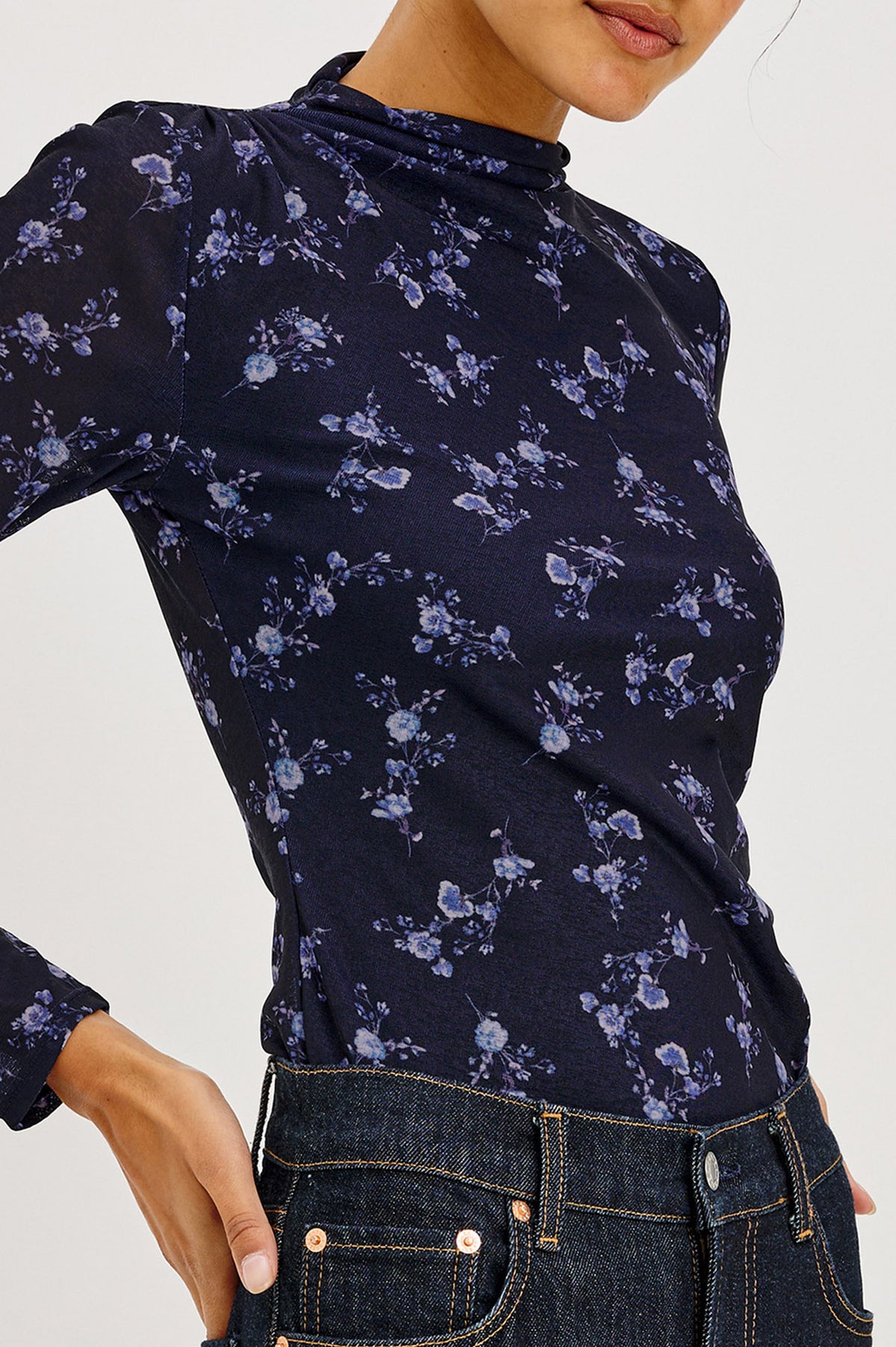 Joelle Top in Floral Print Mesh With Mock Neck Collar, Gathered Shoulders, and Long Sleeves in Navy Romantic Floral Colorway - Upper Body Front Detail View Featured on Model.