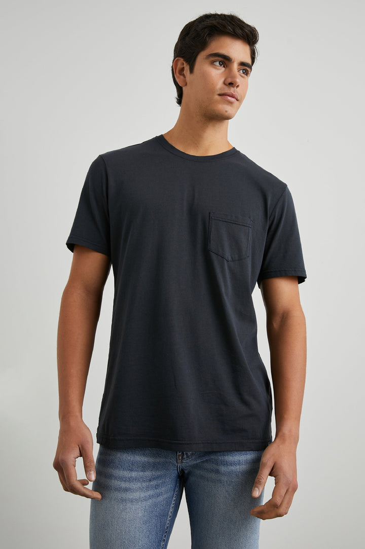 Johnny Short Sleeve T-Shirt with a Crew Neck, Chest Patch Pocket and Small Slits at the Side Hems in Carbon Colorway - Front View Featured on Model
