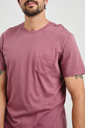 Johnny Short Sleeve T-Shirt with a Crew Neck, Chest Patch Pocket and Small Slits at the Side Hems in Cranberry Colorway - Front View Featured on Model