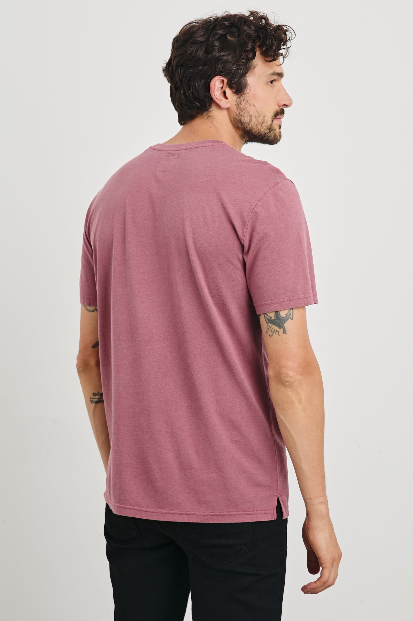 Johnny Short Sleeve T-Shirt with a Crew Neck, Chest Patch Pocket and Small Slits at the Side Hems in Cranberry Colorway - Back View Featured on Model