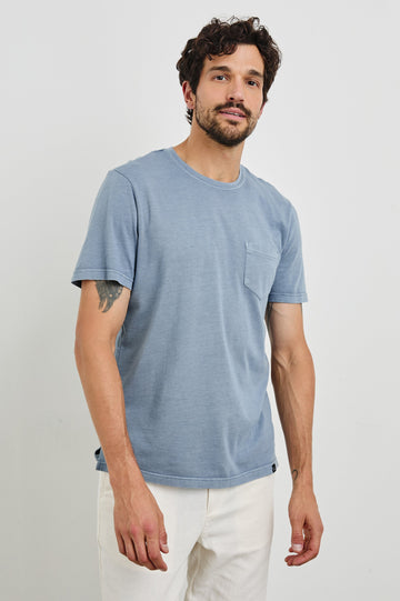 Johnny Short Sleeve T-Shirt with a Crew Neck, Chest Patch Pocket and Small Slits at the Side Hems in Steel Colorway - Front View Featured on Model