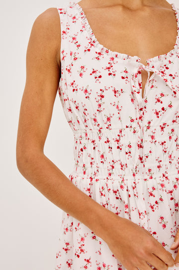 Jordie Maxi Dress in Cotton Voile With A-Line Silhouette, Rounded Square Neckline, Ruffle Trim, Center-Front Bust Cutrout With Self-Ties, Smocked Waist, Side Pockets, and Fully Lined Skirt in Rouge Romantic Colorway - Upper Body Front Close Up View Featured on Model