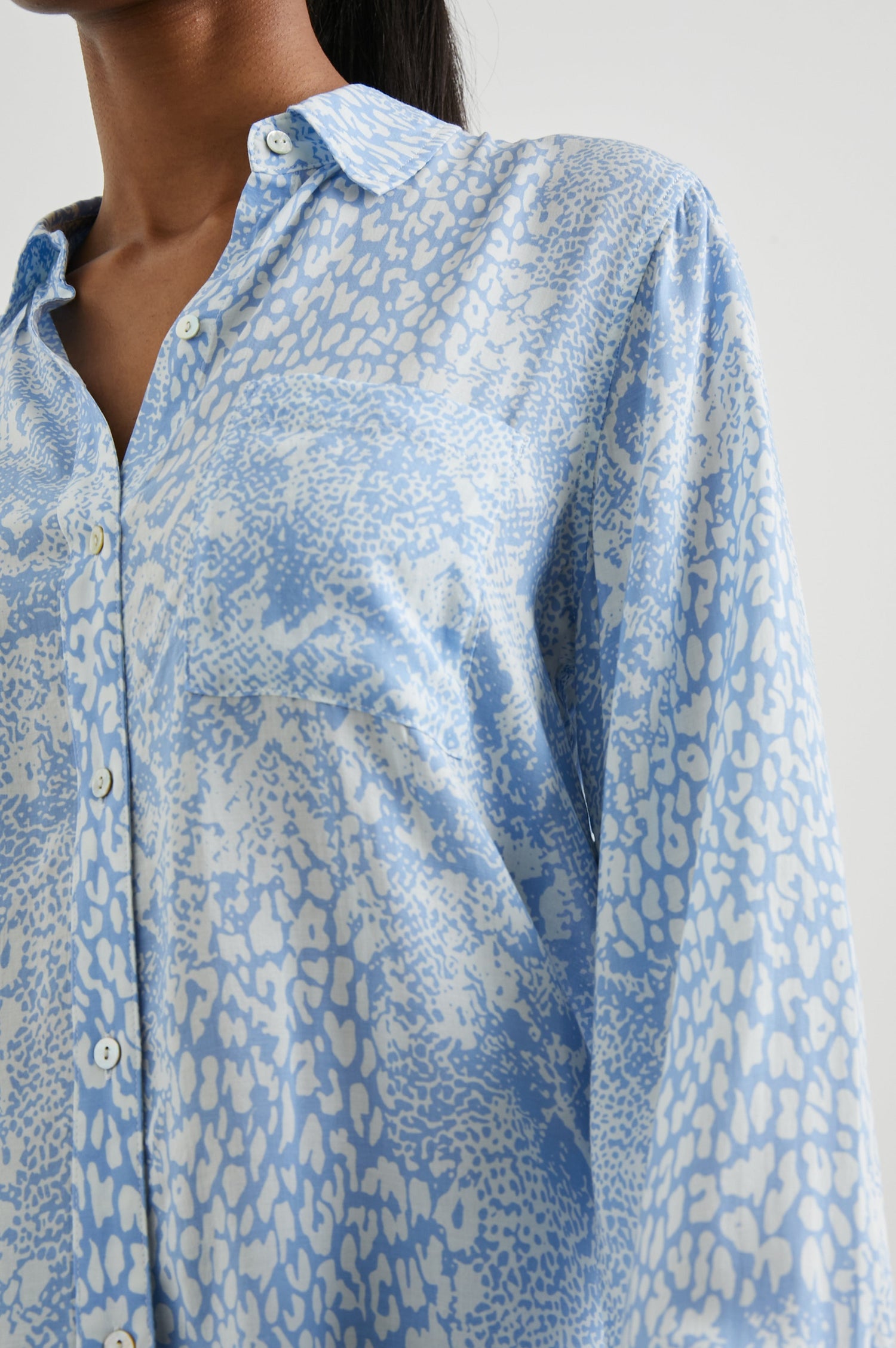Josephine Long-Sleeve Button Down with a Chest Patch Pocket in Aqua Mixed Animal Colorway, aqua animal patterns on white - Front View Featured on Model