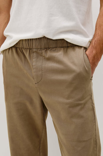 Julian Pants with an Elastic Waist, Two Front Pockets and Two Back Welt Pockets in Barley Colorway - Front Detail View Featured on Model 
