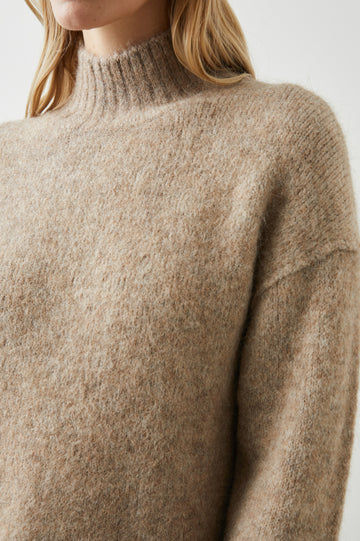 Kacia Long-Sleeve Sweater with a Mock Neck and Ribbed Trim in Oatmeal Colorway - Front View Featured on Model 