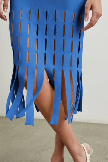 Kaia Sleeveless Midi Dress with a V Neck and Vertical Dashed Cutouts From the Thigh Downward, ending in Panels in Sapphire Colorway - Front View Featured on Model