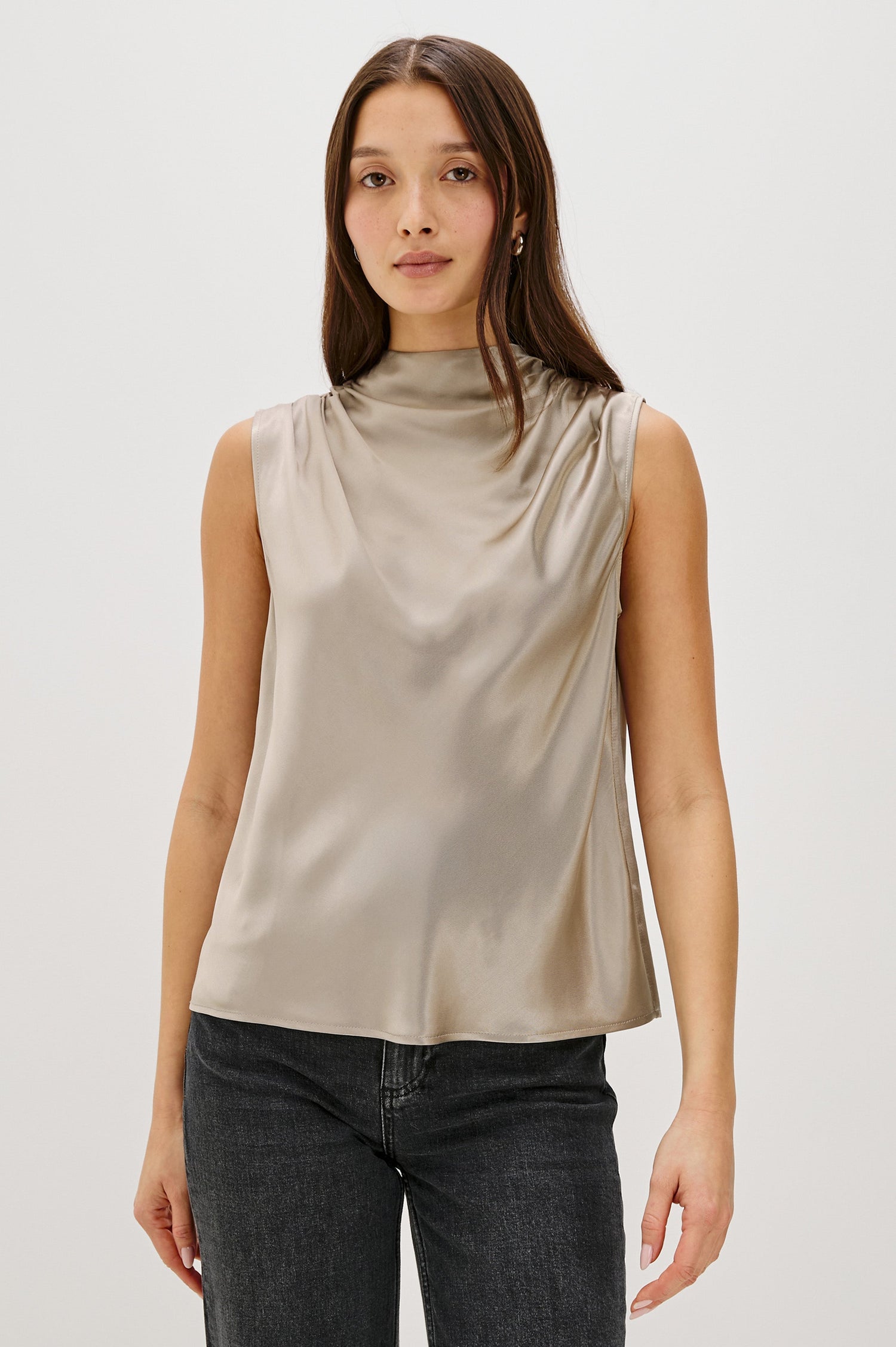 Kaleen Sleeveless Top with Mock Neck with Buttons and Keyhole on the Back and Draped Fabric on the Upper Chest in Mink Colorway - Front Untucked View Featured on Model