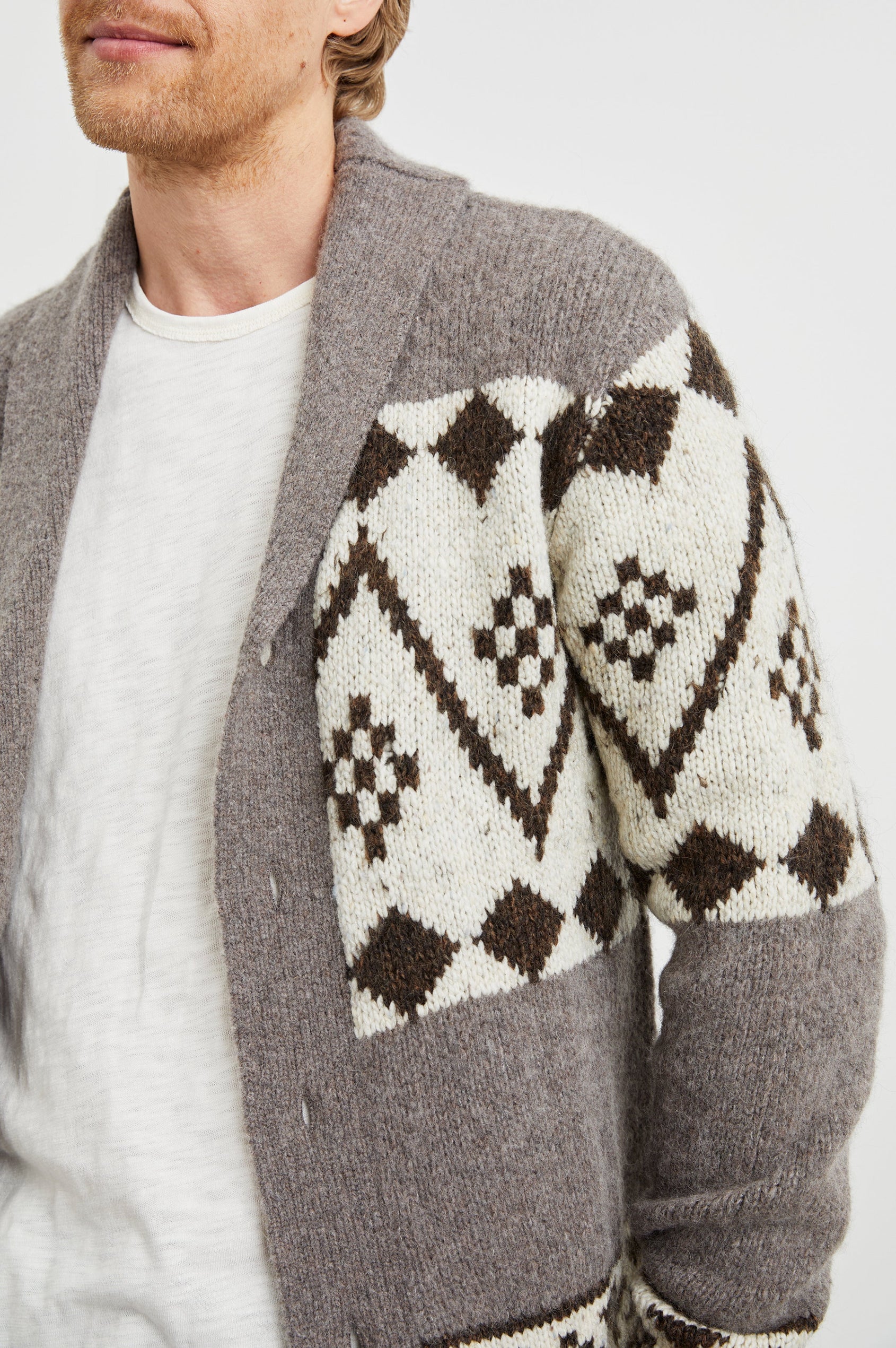 Kallio Long Sleeve Cardigan with Button Closure, V Neck and Ribbed Trim in Maple Oat Colorway, a Maple and Cream Geometric Pattern on Oat - Front View Featured on Model