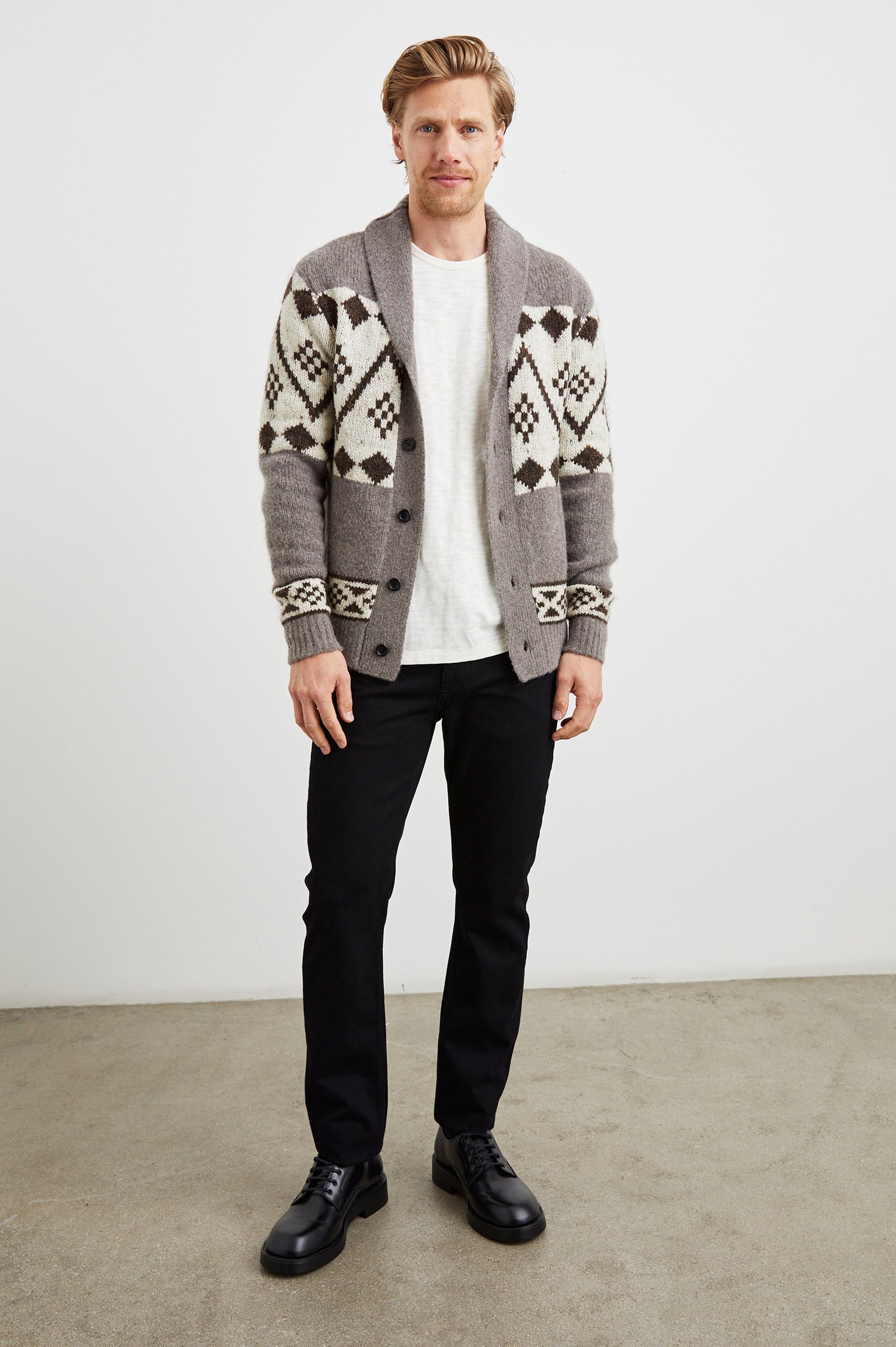 Kallio Long Sleeve Cardigan with Button Closure, V Neck and Ribbed Trim in Maple Oat Colorway, a Maple and Cream Geometric Pattern on Oat - Front Full Body View Featured on Model