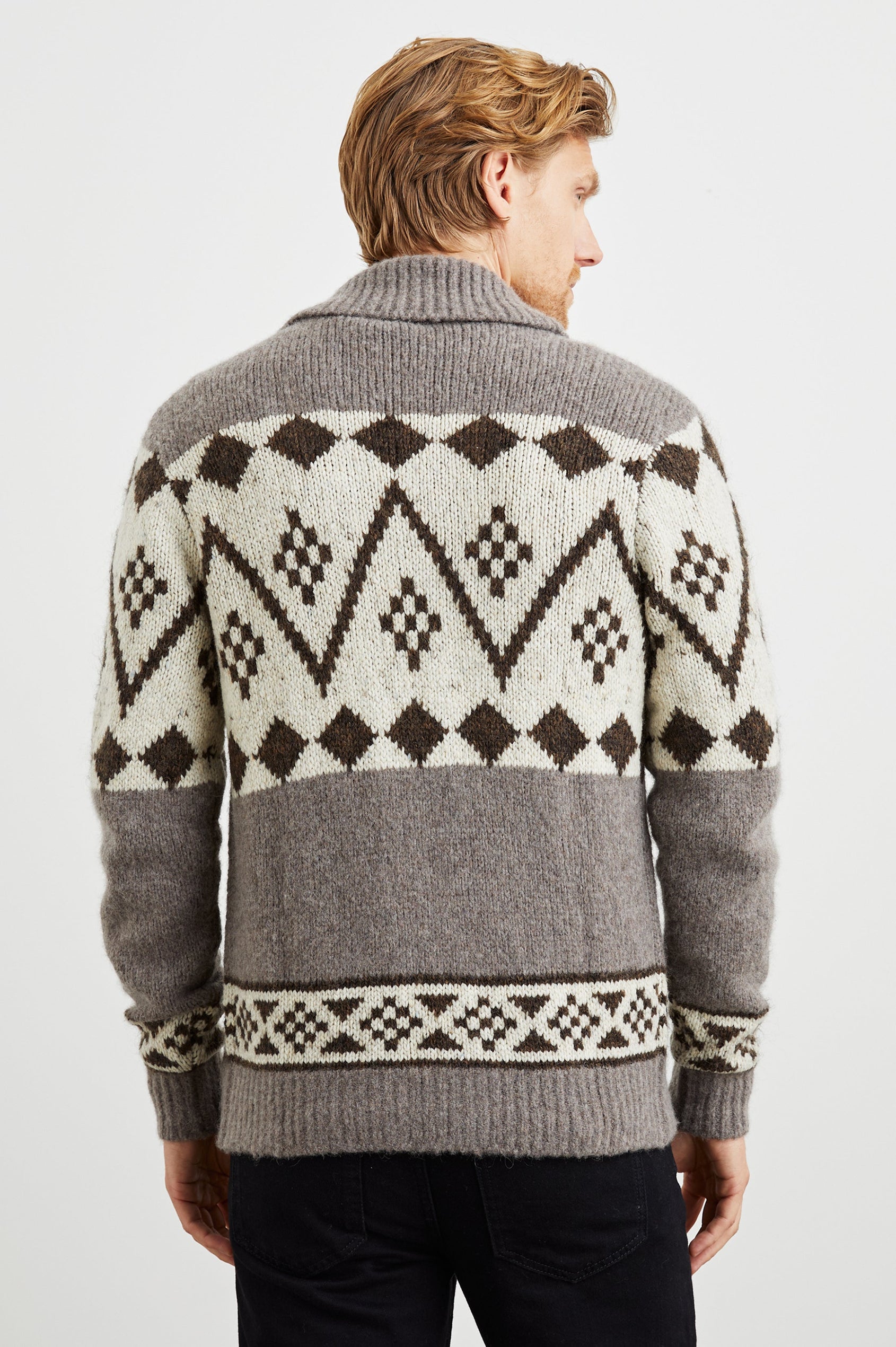 Kallio Long Sleeve Cardigan with Button Closure, V Neck and Ribbed Trim in Maple Oat Colorway, a Maple and Cream Geometric Pattern on Oat - Back View Featured on Model