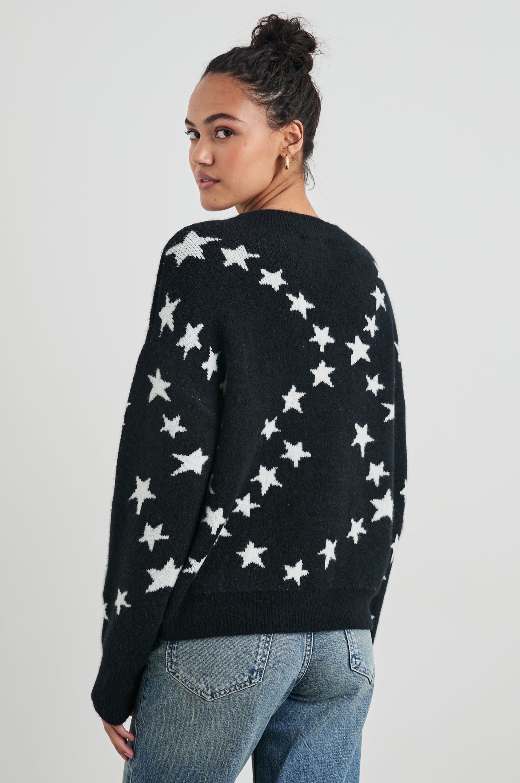 Kana Long-Sleeve Sweater with a Crew Neck in Star Chain Colorway, White Stars on Black - Back View Featured on Model 