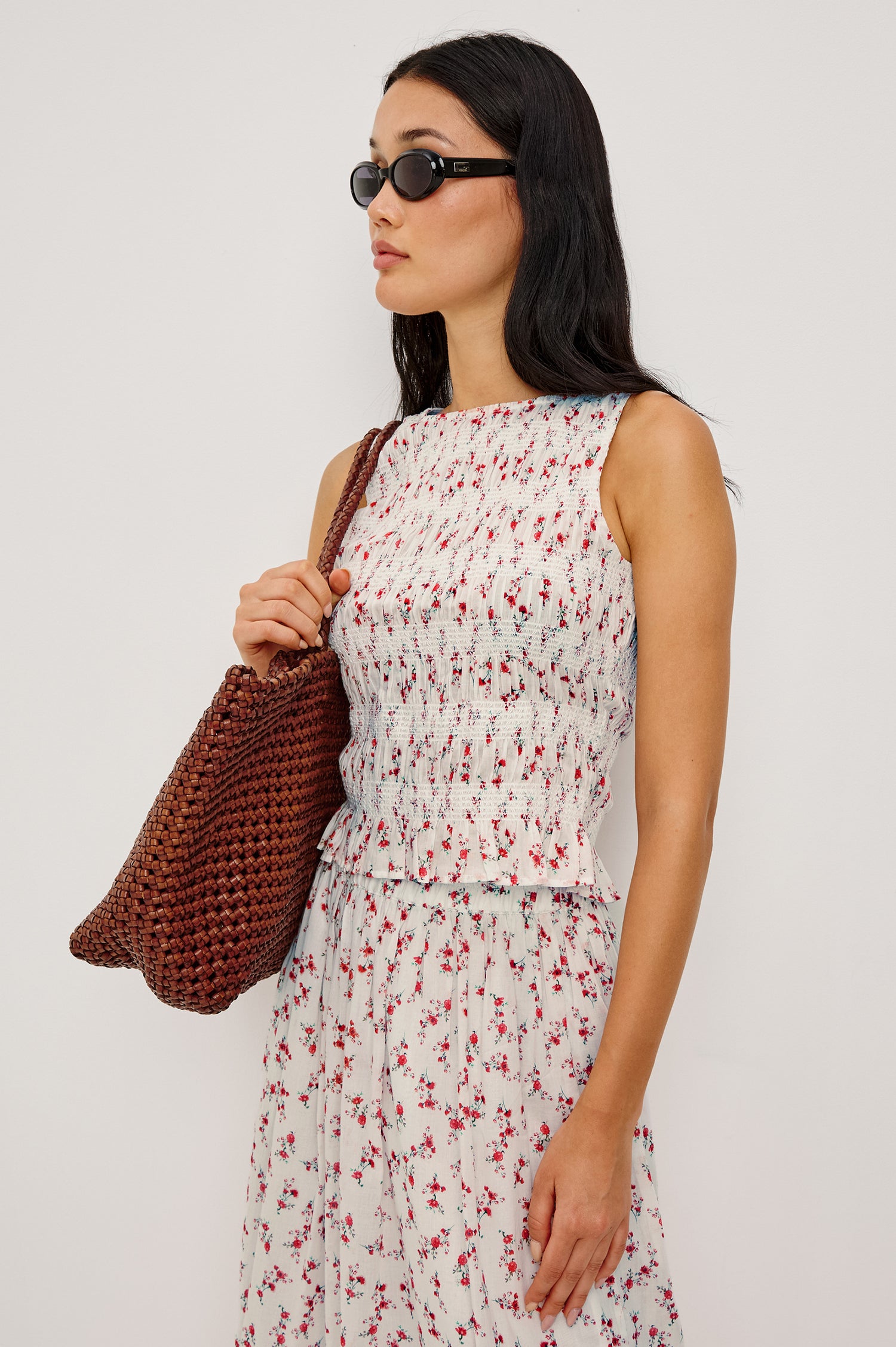 Kane Sleeveless Fitted Top in Cotton With Diamond Smocking All Over High Boat Neckline and Flared Ruffle Hem in Rouge Romantic Colorway - Upper Body Front View Featured on Model