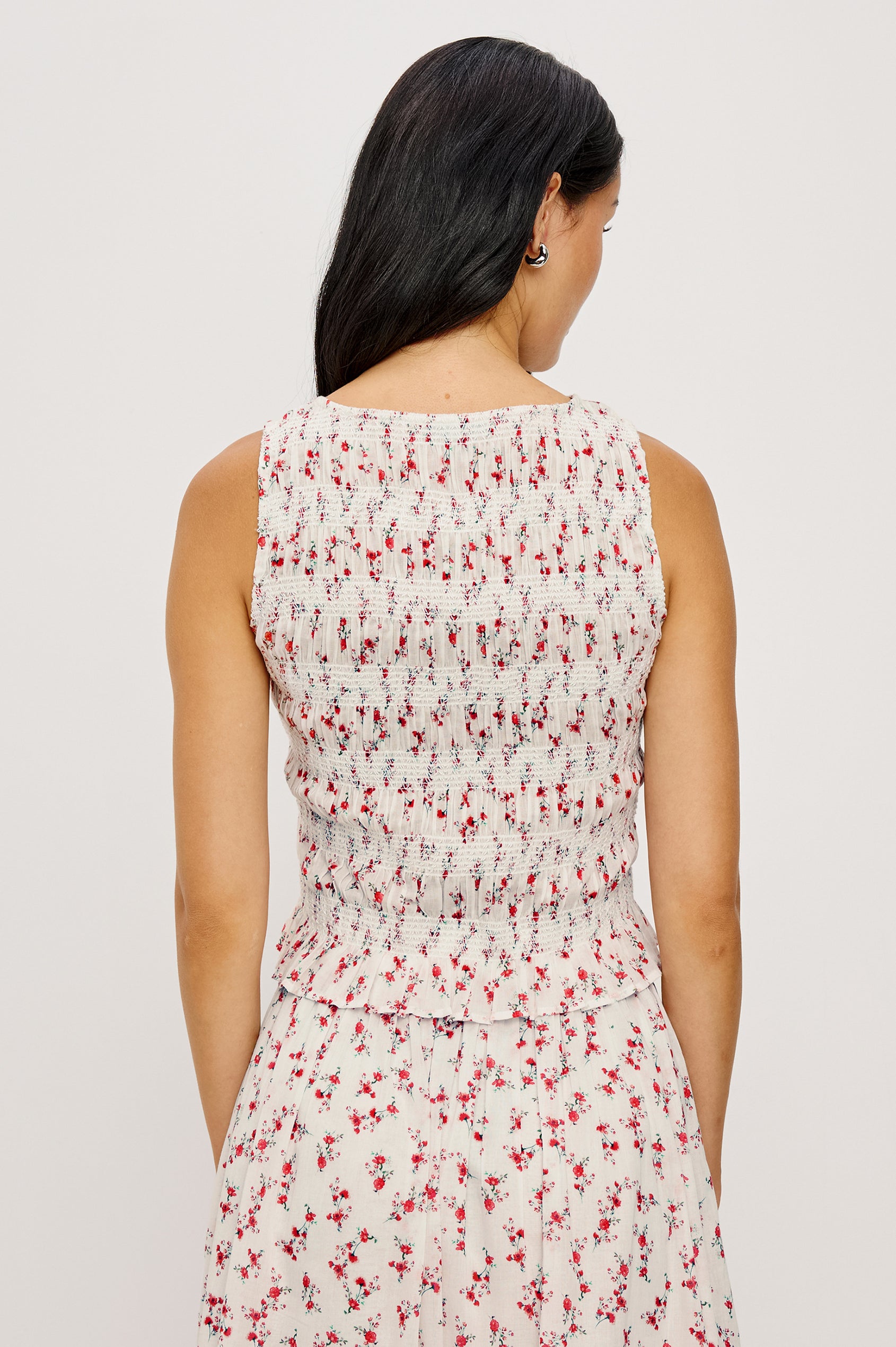 Kane Sleeveless Fitted Top in Cotton With Diamond Smocking All Over High Boat Neckline and Flared Ruffle Hem in Rouge Romantic Colorway - Upper Body Back View Featured on Model