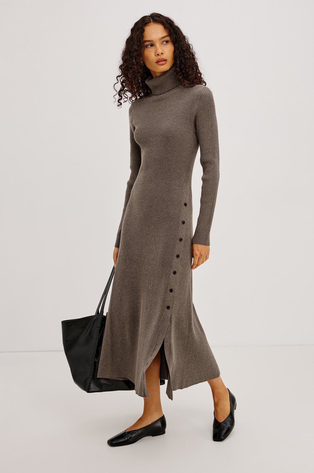 Kat Maxi Dress in Ribbed Cotton Blend With Foldover Turtleneck Button Neckline, Long Sleeves, Fitted Silhouette, Long Sleeves, Side Placket, and Subtle Flare at Hem in Hazelnut Colorway - Full Body Front View Featured on Model