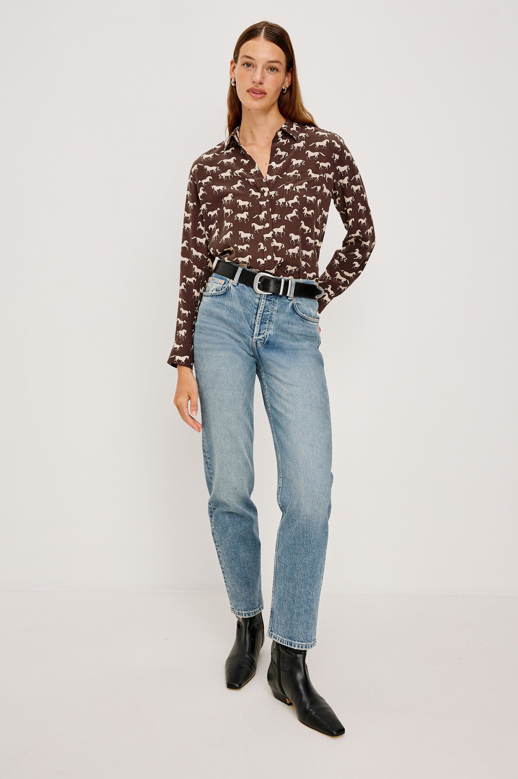 Washed silk button-down shirt in ivory with a horse print. The shirt has a soft drape and classic collar for a polished look. Full Body Front View on Model.