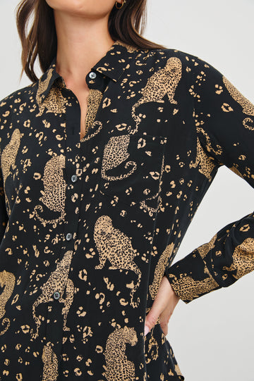 Kate Long Sleeve Button up with a Chest Patch Pocket in Noir Leopard Colorway, gold leopards and spots on Black - Front View Featured on Model