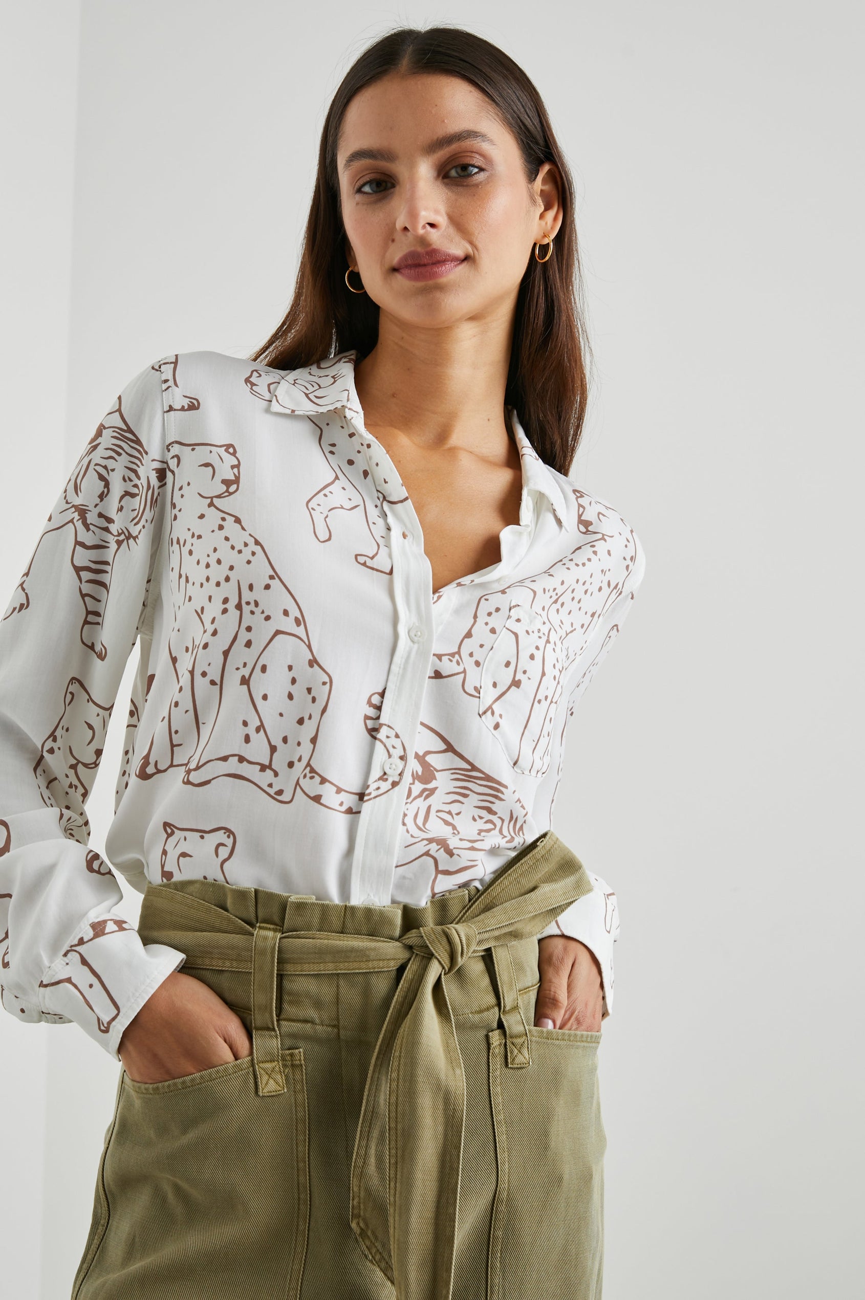 Kathryn Long-Sleeve Button up with a Chest Patch Pocket in Camel Jungle Colorway, with large camel jungle cats on  ivory - Front tucked View Featured on Model
