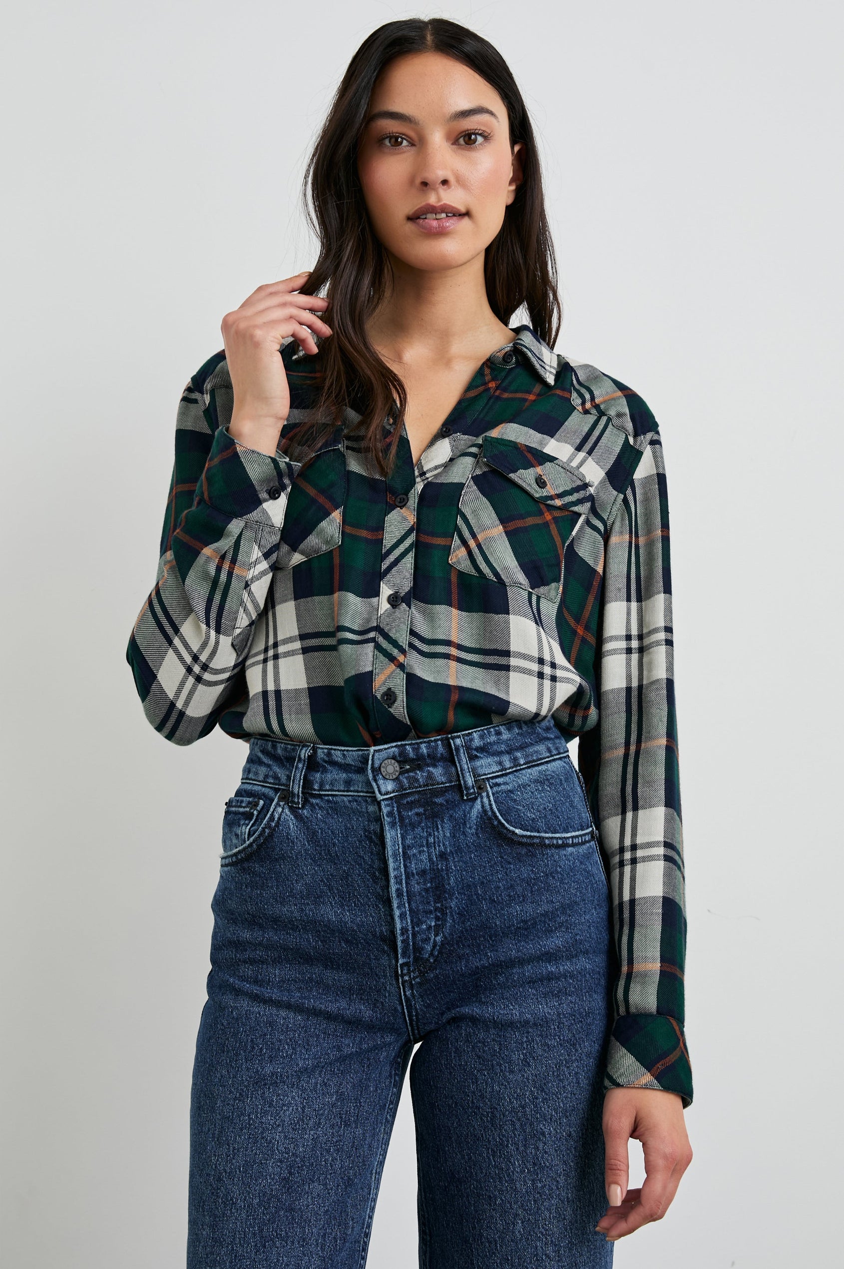 Kendra Long-Sleeve Button Up with Two Chest Button Flap Pockets in Forest Navy Stone Colorway, a Plaid with an Interior Black and White Plaid - Front Tucked View Featured on Model