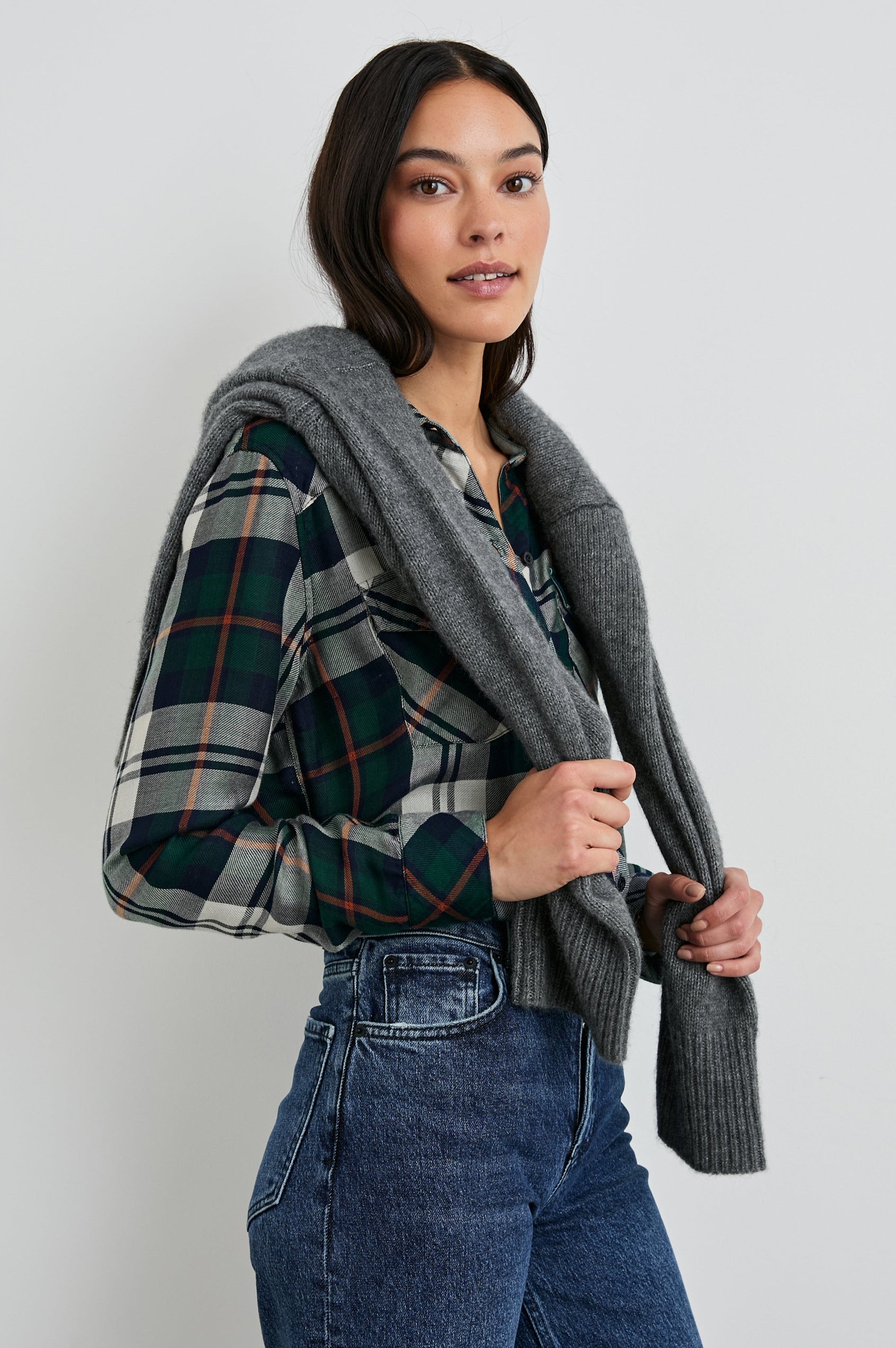 Kendra Long-Sleeve Button Up with Two Chest Button Flap Pockets in Forest Navy Stone Colorway, a Plaid with an Interior Black and White Plaid - Front Tucked View Featured on Model