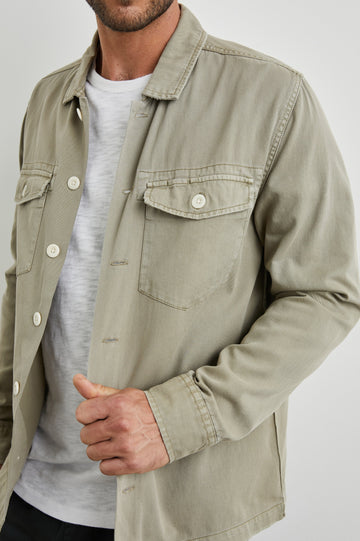 Kerouac Long-Sleeve Shirt Jacket with Button Closure and Two Button Chest Flap Pockets in Natural Colorway  - Front Unbuttoned View Featured on Model
