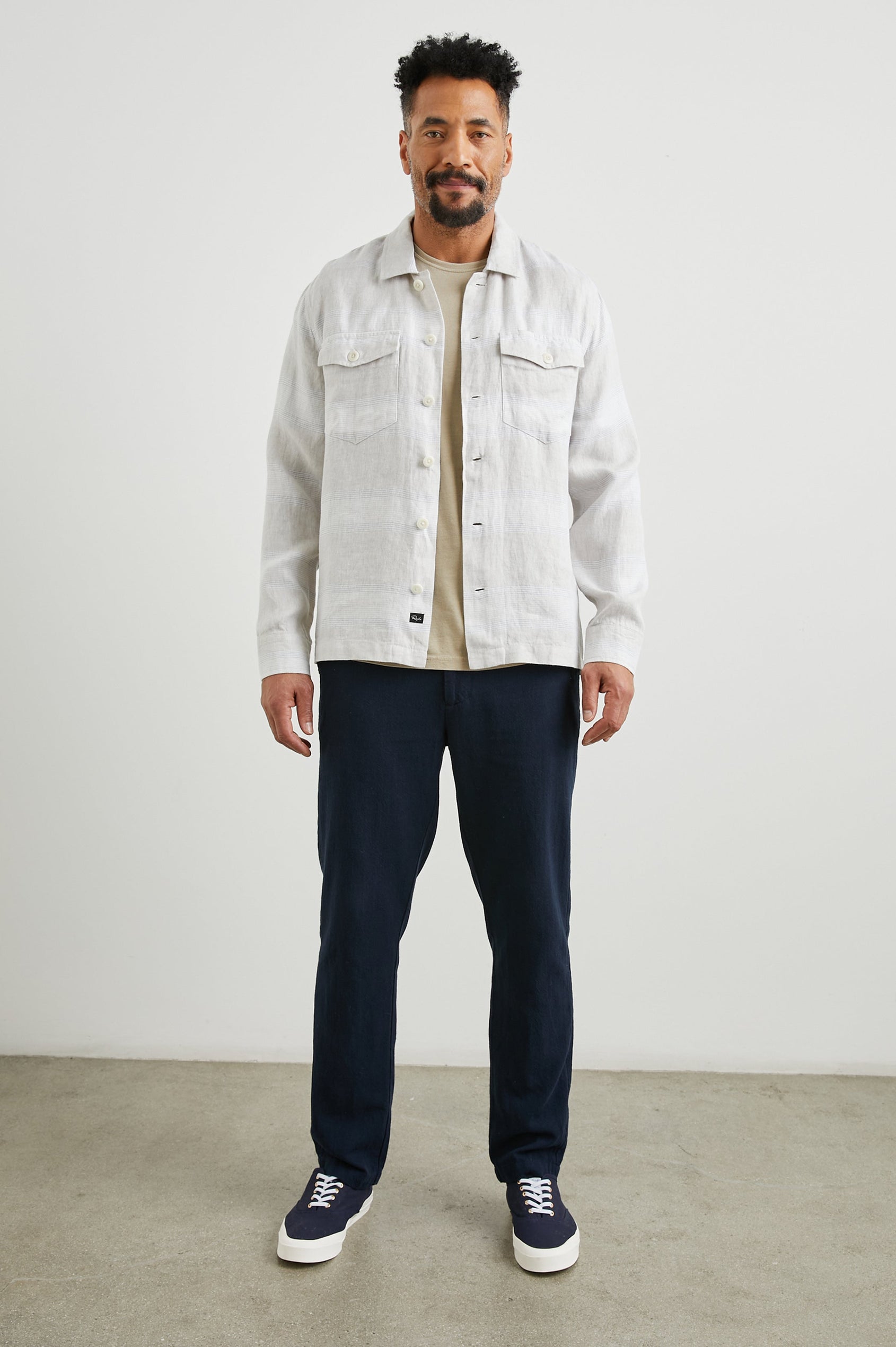 Kerouac Long-Sleeve Shirt Jacket with Button Closure and Two Button Chest Flap Pockets in Wicker Graphite Stripe Colorway, Grey and White Horizontal Stripes on Wicker  - Front Unbuttoned Full Body View Featured on Model