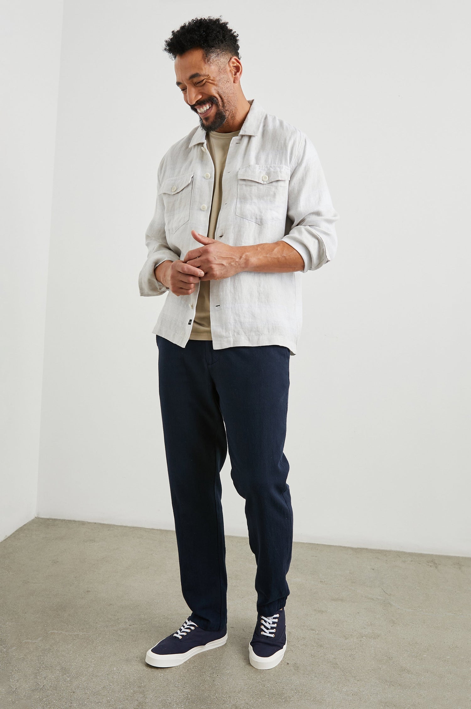 Kerouac Long-Sleeve Shirt Jacket with Button Closure and Two Button Chest Flap Pockets in Wicker Graphite Stripe Colorway, Grey and White Horizontal Stripes on Wicker  - Front Unbuttoned View Featured on Model
