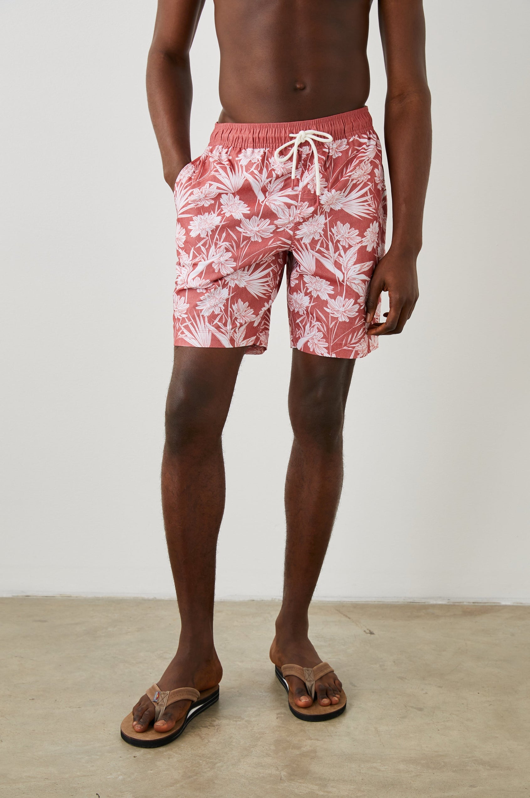 KIAN SWIM SHORT JUNGLE FOLIAGE RED - FRONT HAND IN POCKET