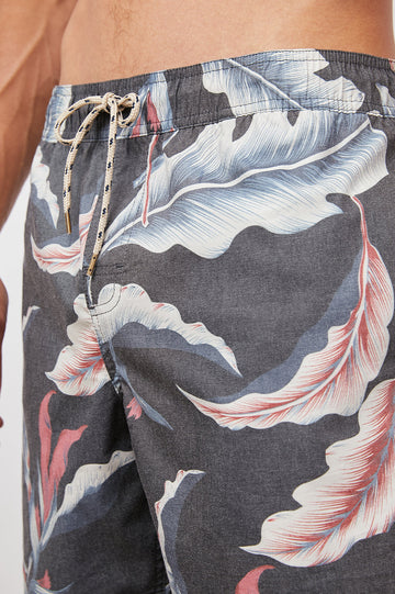 Kian Swim Shorts with an Elastic Drawstring Waistband, Two Front Pockets and a Back Button Flap Pocket in Paradise Nights Colorway, a Floral Print in Pinks, Blues and White on Black - Front View Featured on Model