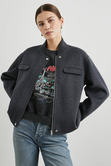Kinsley Jacket with Zipper and Snap Closure, Two Chest Welt Flap Pockets and two Front Pockets in Charcoal Colorway - Front View Featured on Model