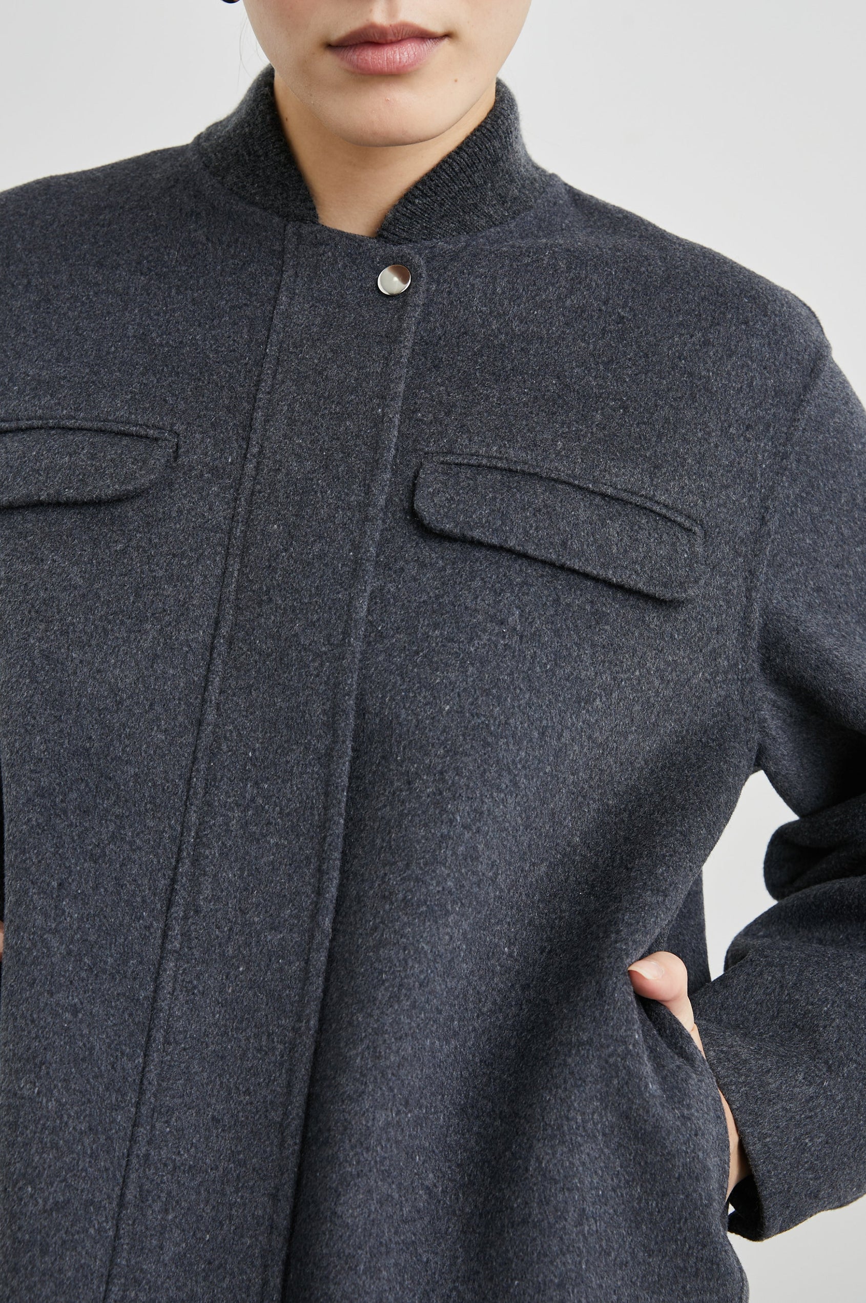 Kinsley Jacket with Zipper and Snap Closure, Two Chest Welt Flap Pockets and two Front Pockets in Charcoal Colorway - Front View Featured on Model