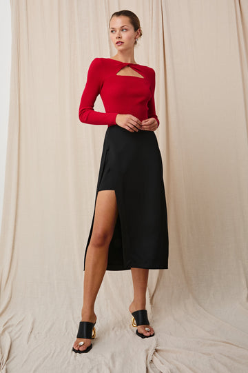 Kira Midi Skirt with a Side Slit and an Inner Midi Skirt in Black Colorway - Front Full Body View Featured on Model 