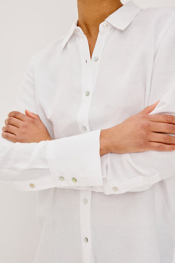 Knox Button-Up Shirt in Linen Viscose With Collar, Front Buttons, Long Sleeves, and Relaxed Fit in White Colorway - Upper Body Close Up Front View Featured on Model