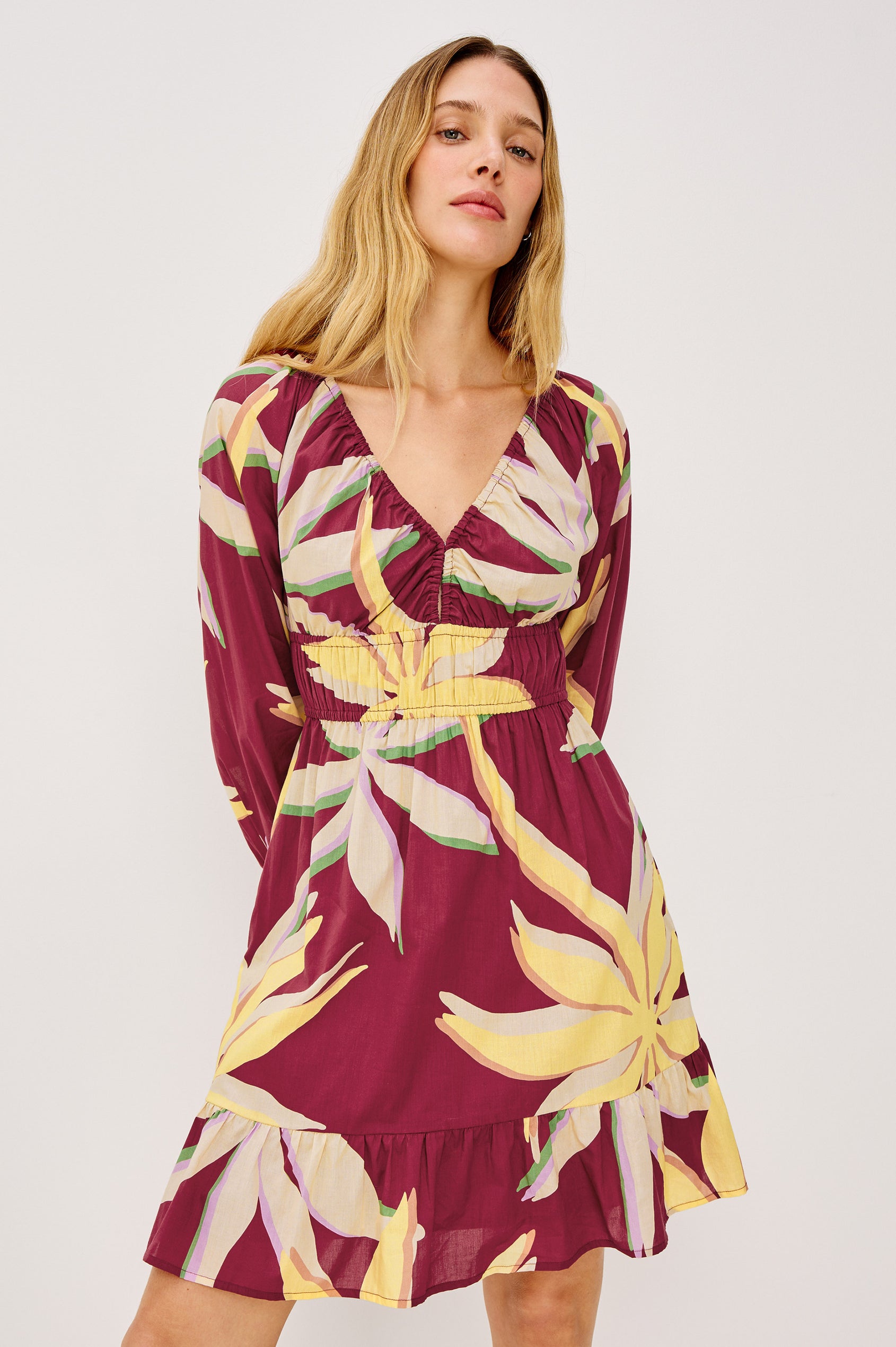 Krina Mini Dress in Cotton Poplin With Deep V-Neckline, Center Front Ties, Long Billowing Sleeves, and Tiered Hem in Red Palma Colorway - Upper Body Front View Featured on Model