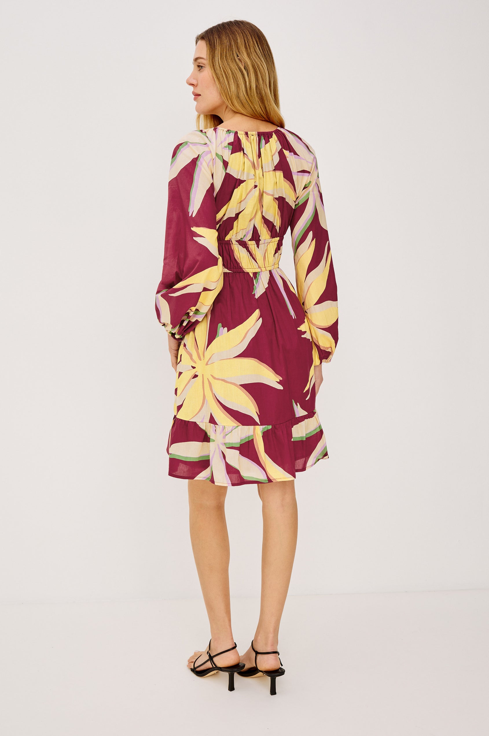 Krina Mini Dress in Cotton Poplin With Deep V-Neckline, Center Front Ties, Long Billowing Sleeves, and Tiered Hem in Red Palma Colorway - Full Body Back View Featured on Model